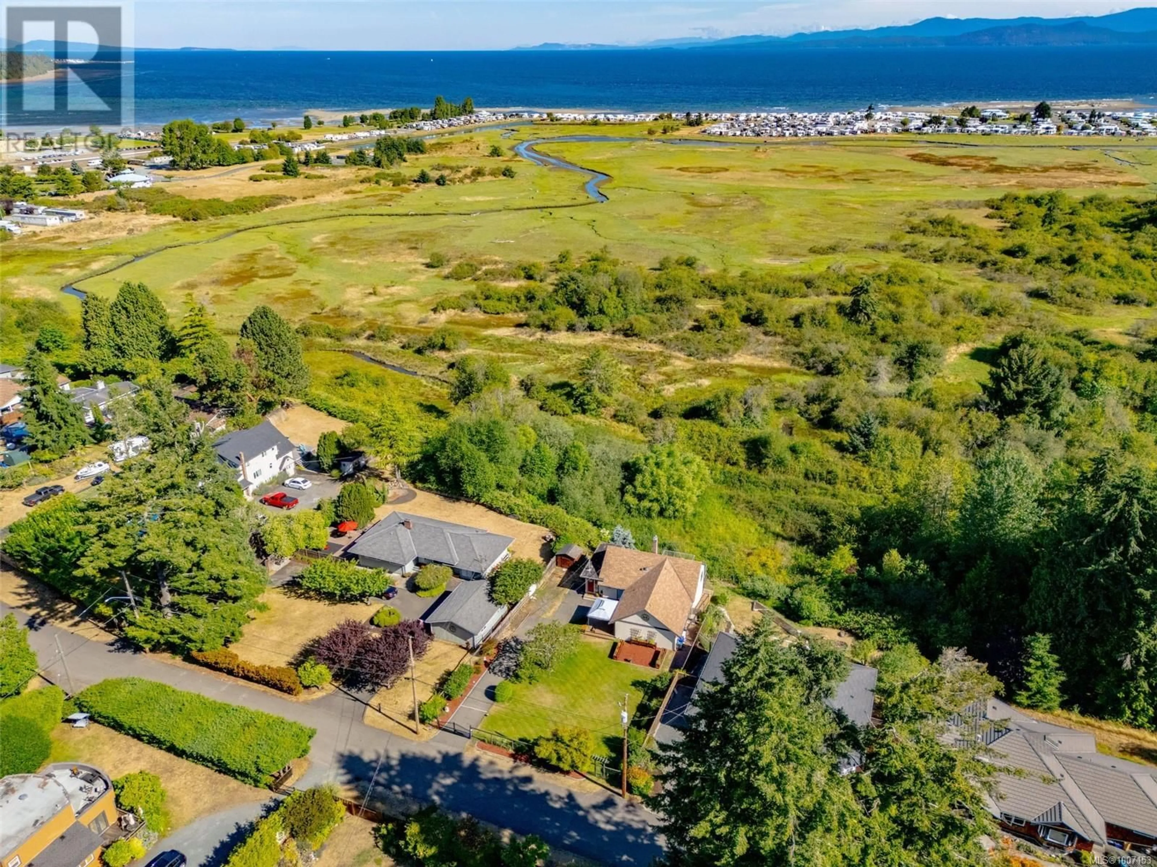 A pic from outside/outdoor area/front of a property/back of a property/a pic from drone, water/lake/river/ocean view for 405 HEATH AVENUE, Parksville British Columbia V9P1V3