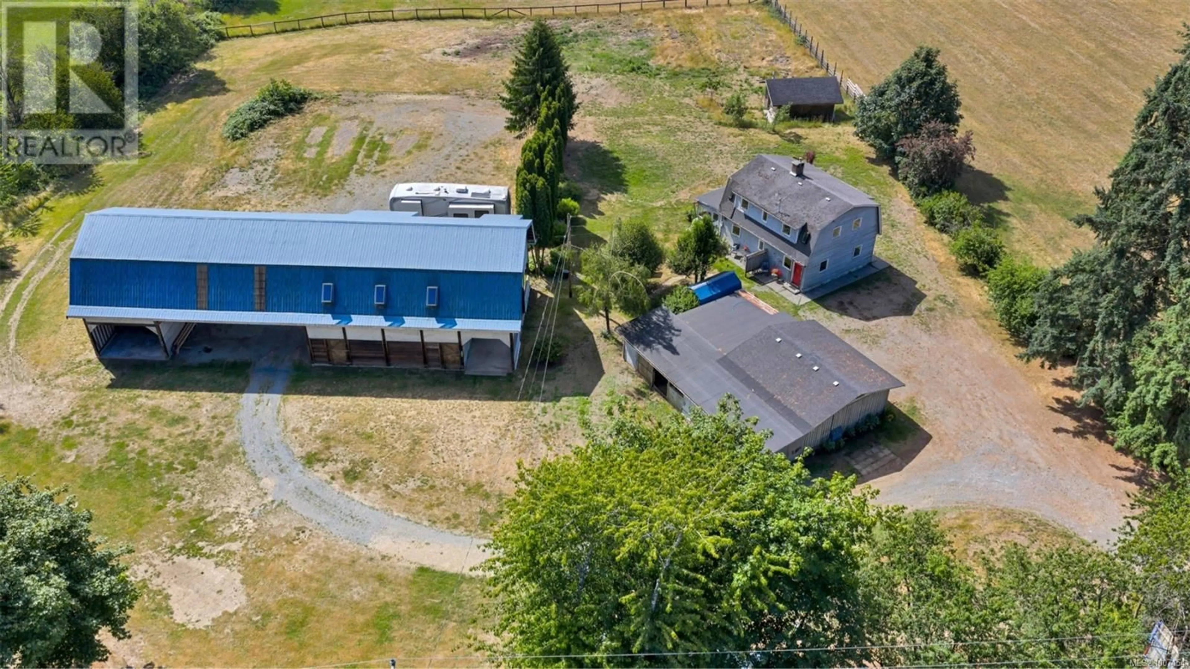 A pic from outside/outdoor area/front of a property/back of a property/a pic from drone, building for 4270 COWICHAN LAKE ROAD, Duncan British Columbia V9L6H2
