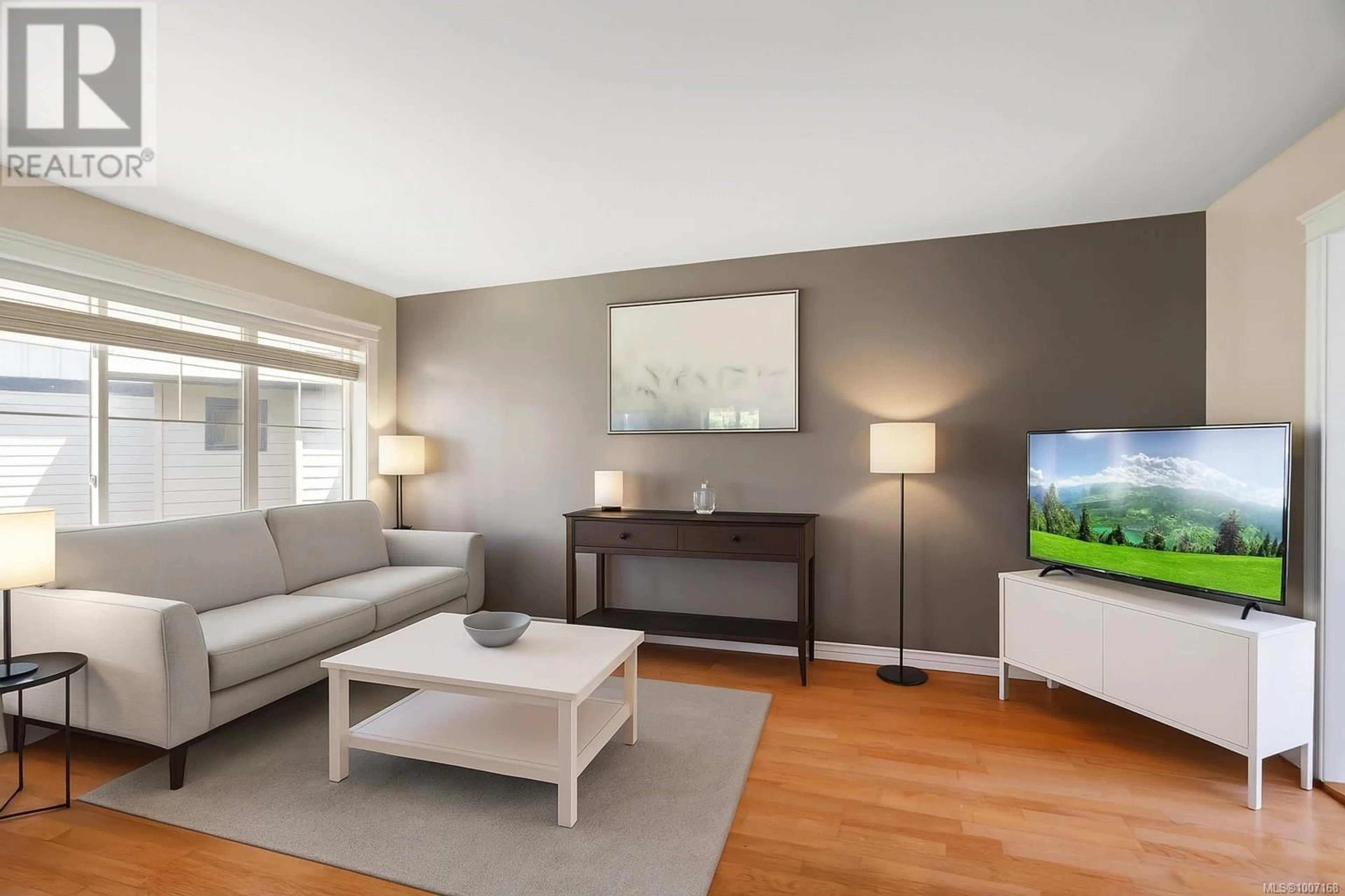 Living room with furniture, wood/laminate floor for 106 - 2678 WINSTER ROAD, Langford British Columbia V9B3R8