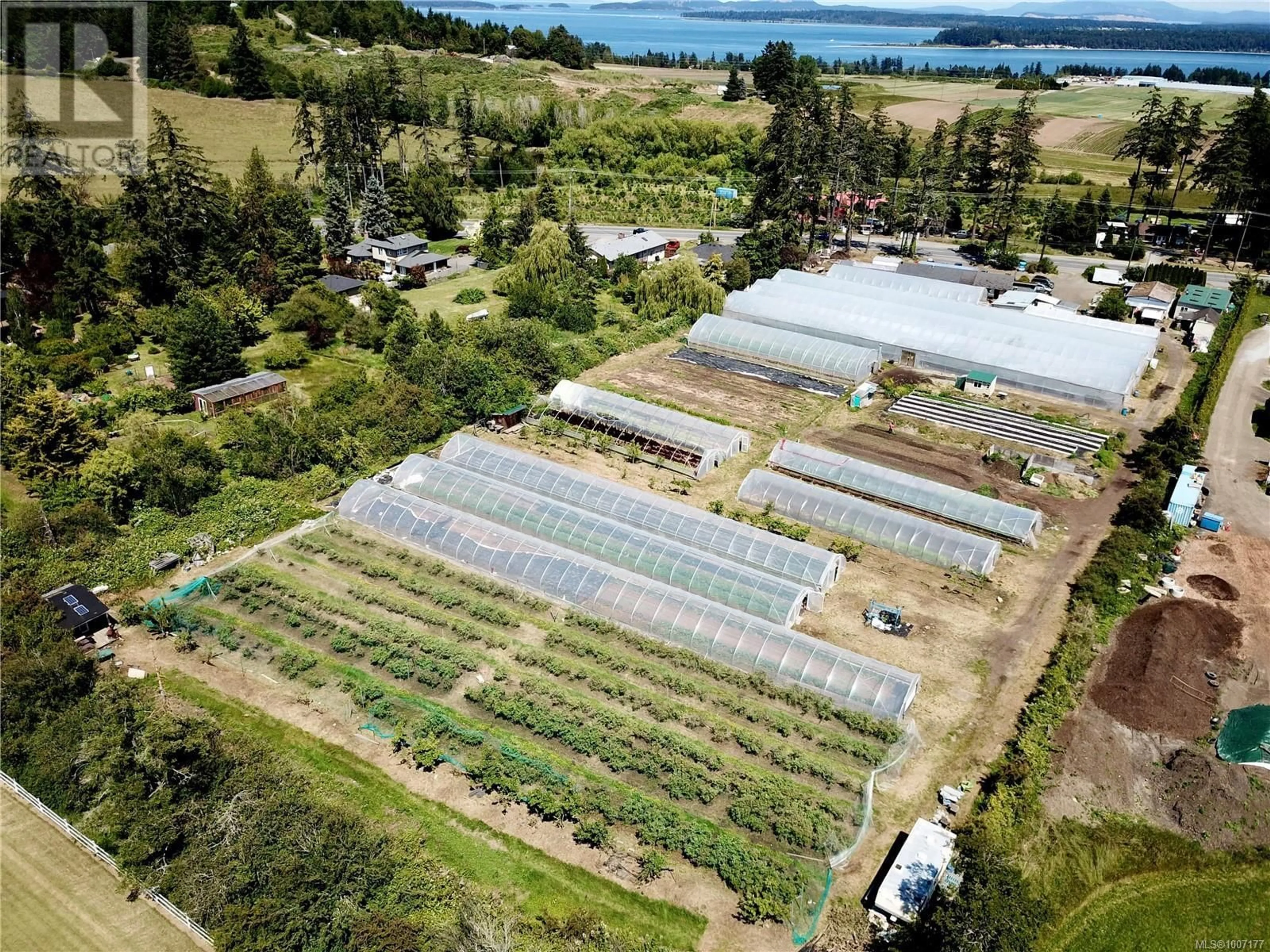 A pic from outside/outdoor area/front of a property/back of a property/a pic from drone, unknown for 8214 EAST SAANICH ROAD, Central Saanich British Columbia V8M1T5