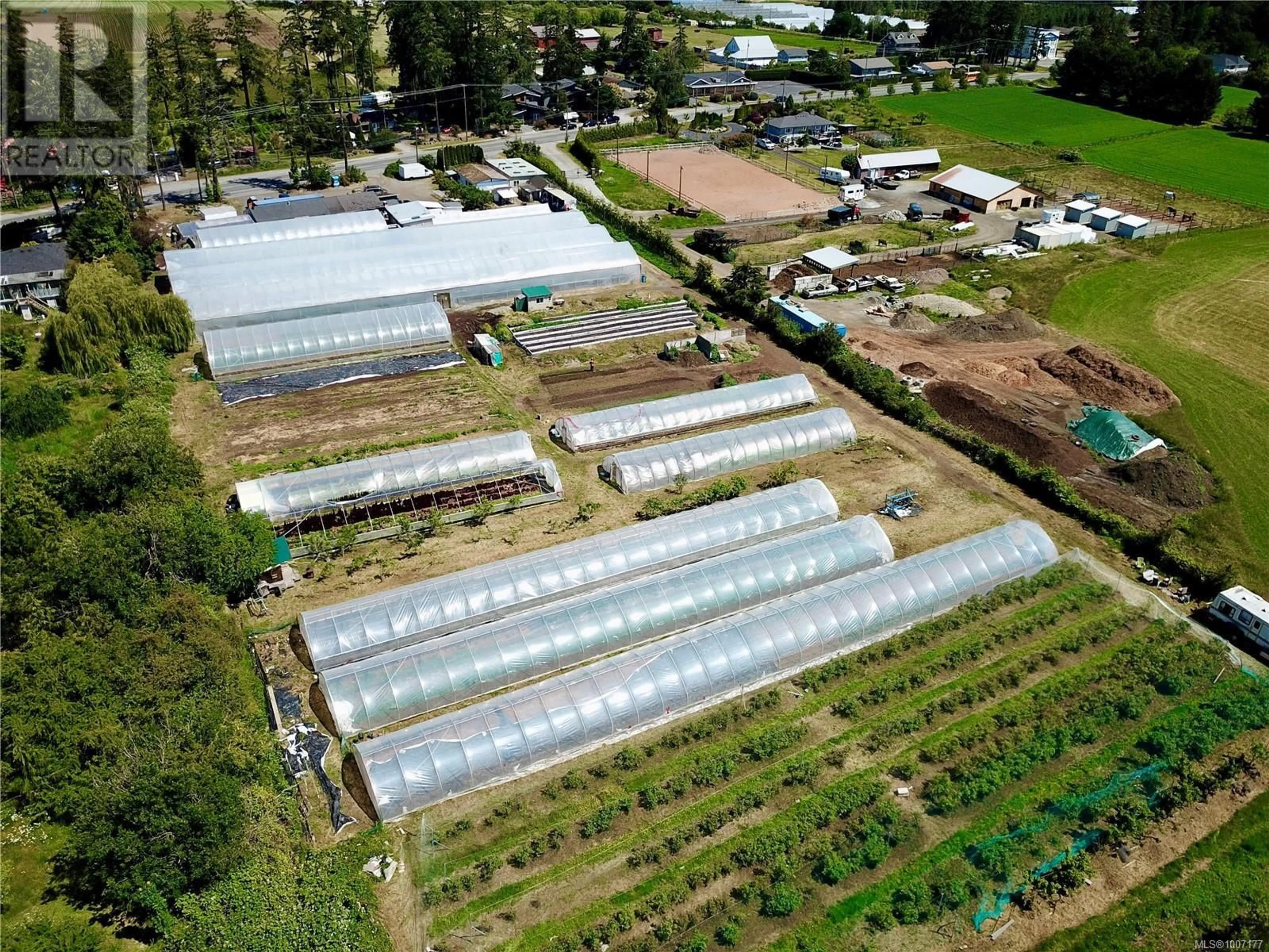 A pic from outside/outdoor area/front of a property/back of a property/a pic from drone, street for 8214 EAST SAANICH ROAD, Central Saanich British Columbia V8M1T5