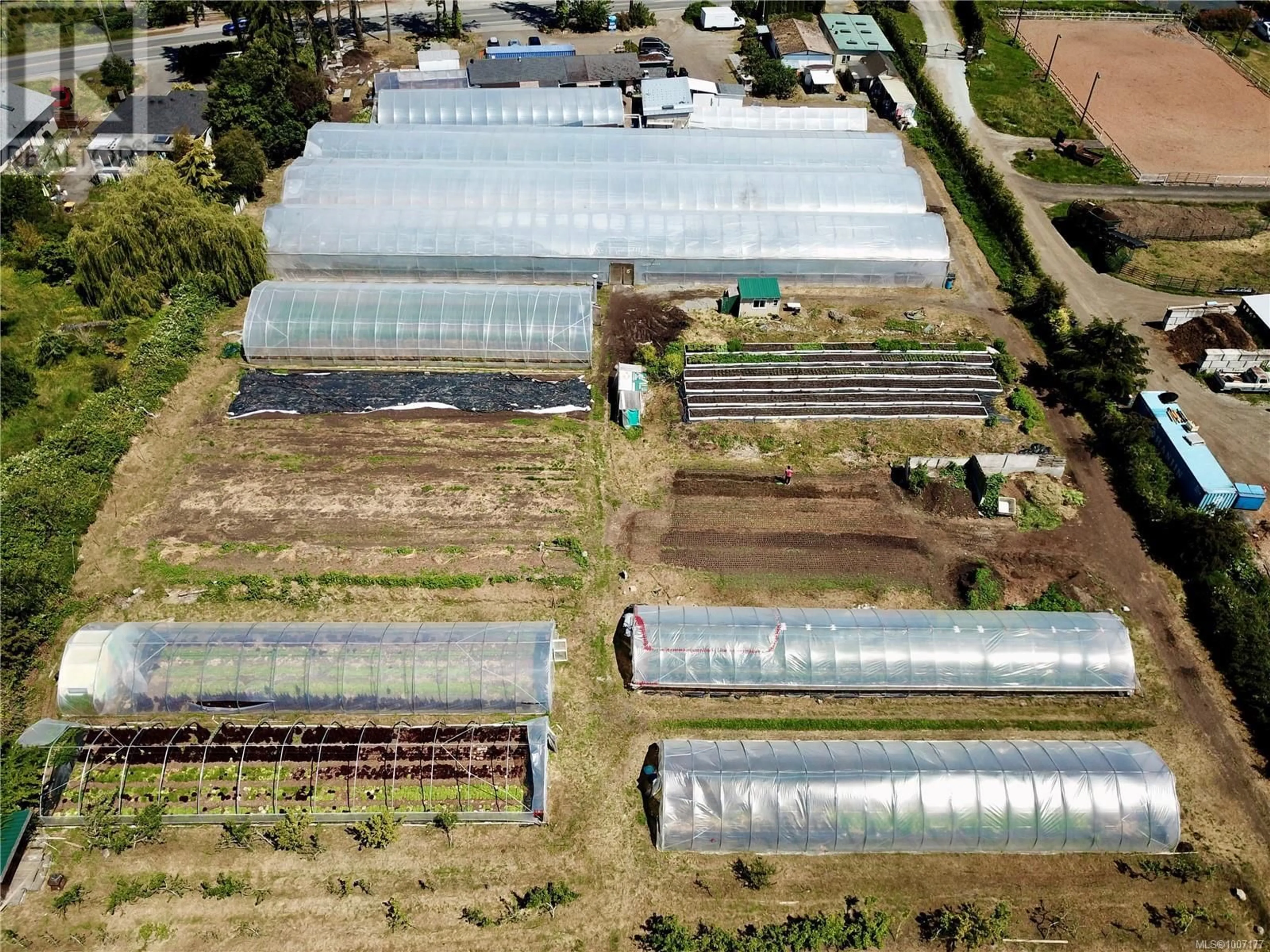 A pic from outside/outdoor area/front of a property/back of a property/a pic from drone, building for 8214 EAST SAANICH ROAD, Central Saanich British Columbia V8M1T5