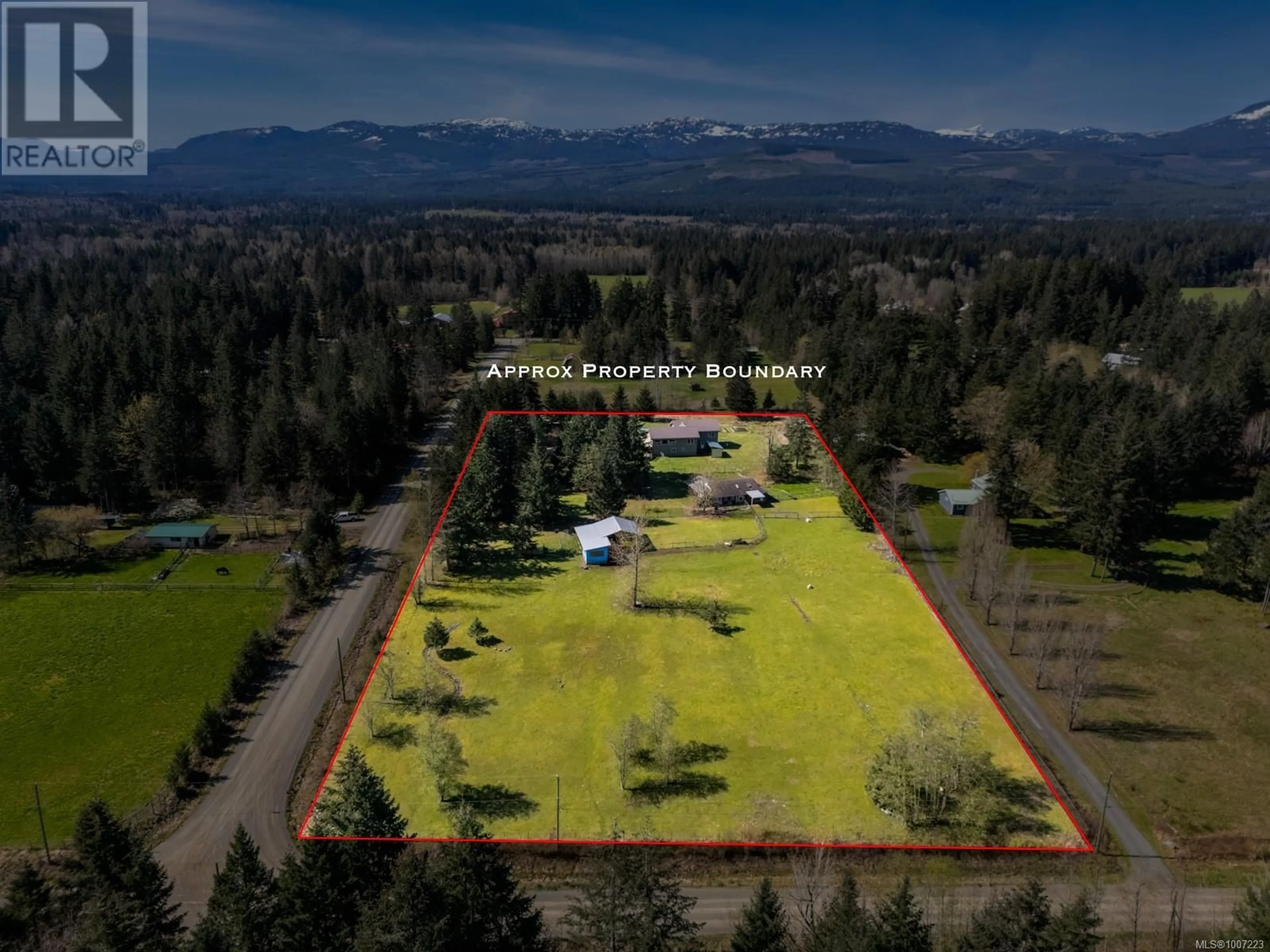 A pic from outside/outdoor area/front of a property/back of a property/a pic from drone, mountain view for 2892 MARIDGE ROAD, Courtenay British Columbia V9J1M9