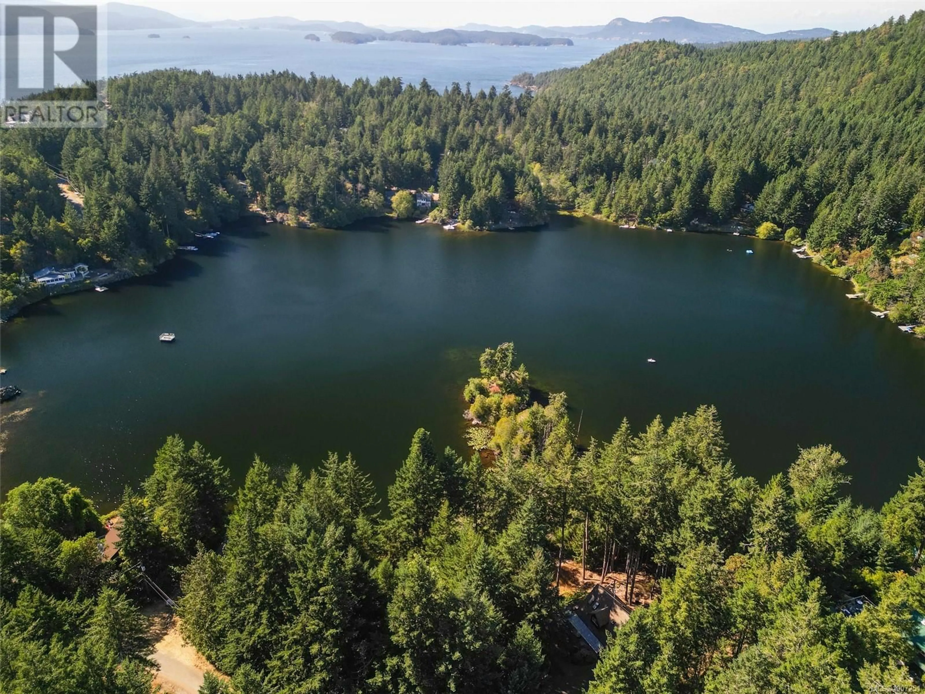 A pic from outside/outdoor area/front of a property/back of a property/a pic from drone, water/lake/river/ocean view for 3711 COMPASS CRESCENT, Pender Island British Columbia V0N2M2