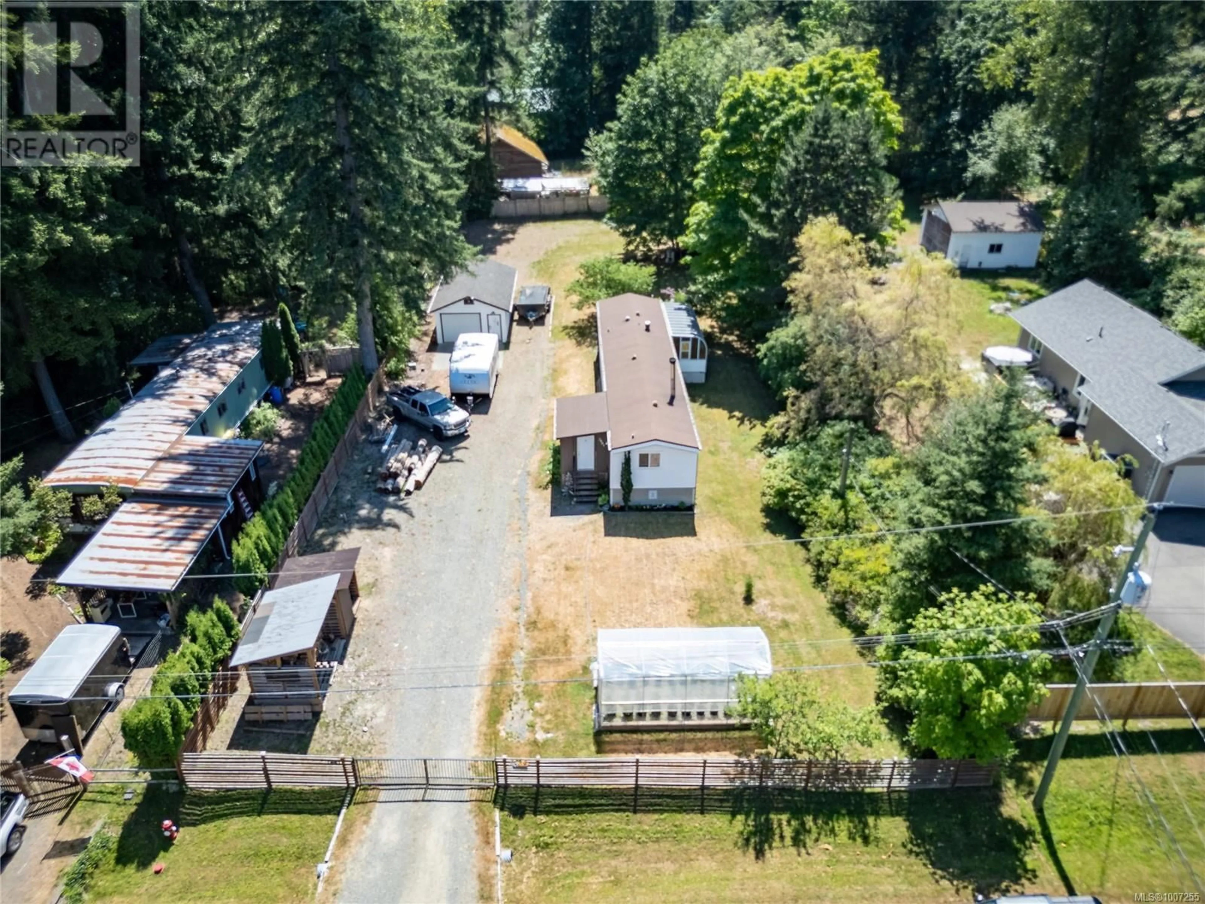 A pic from outside/outdoor area/front of a property/back of a property/a pic from drone, street for 2481 OAKES ROAD, Black Creek British Columbia V9J1J1