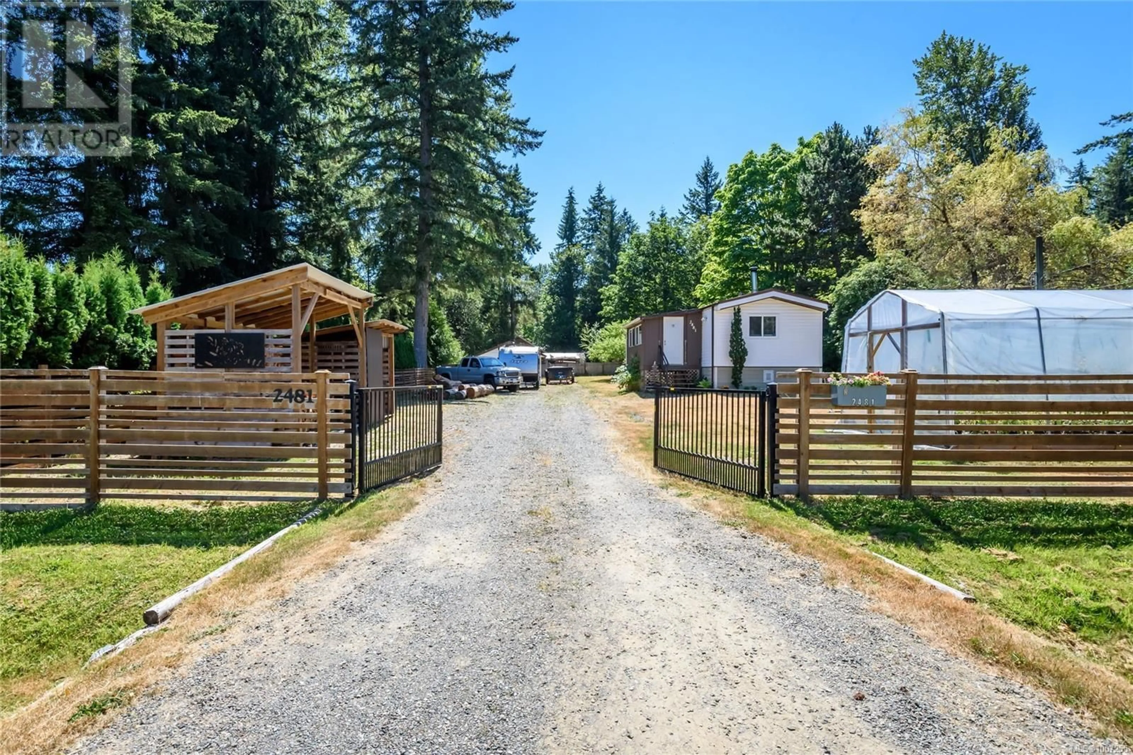 A pic from outside/outdoor area/front of a property/back of a property/a pic from drone, street for 2481 OAKES ROAD, Black Creek British Columbia V9J1J1