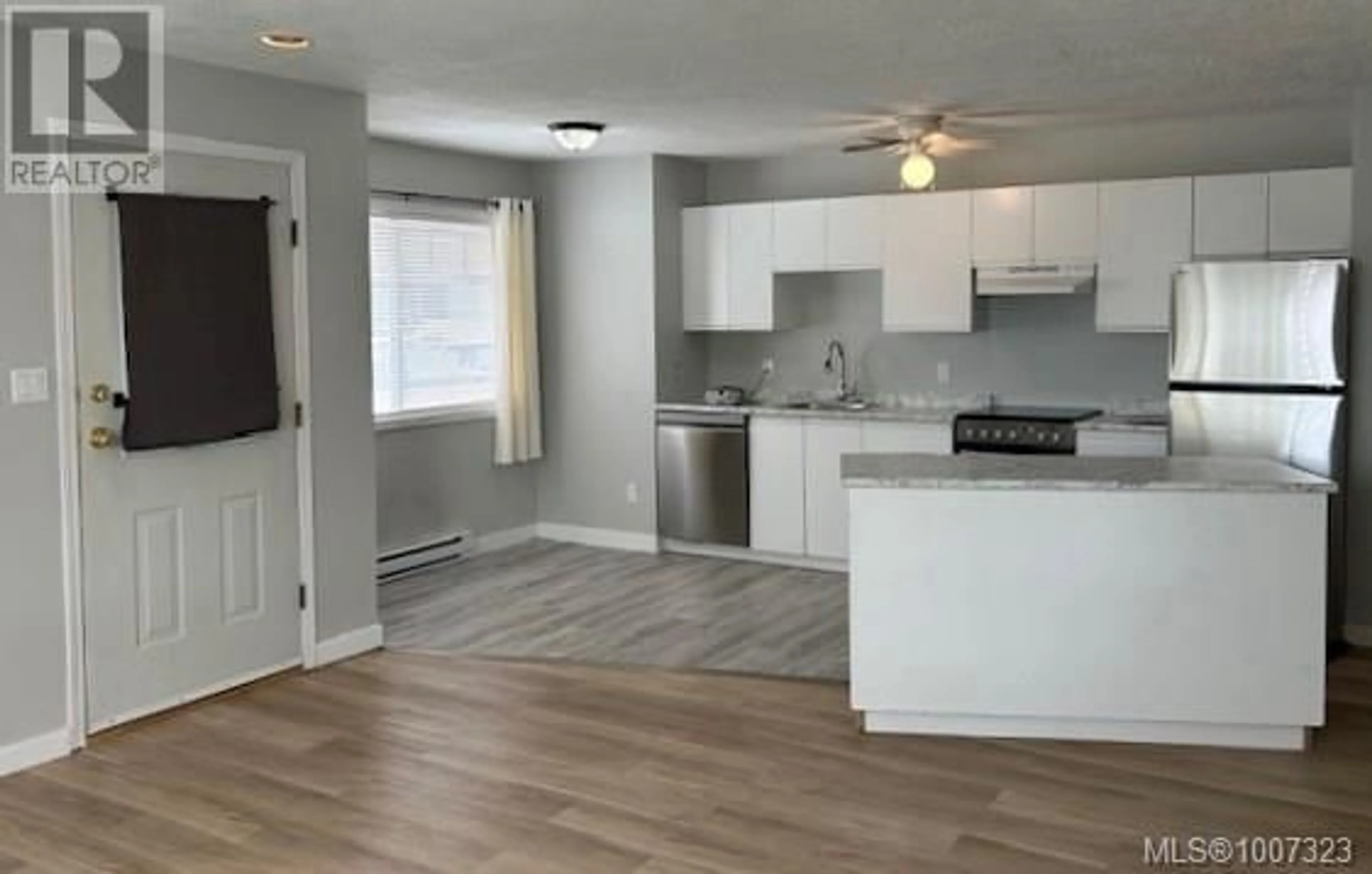 Open concept kitchen, wood/laminate floor for 302 - 2525 DINGWALL STREET, Duncan British Columbia V9L2Y9