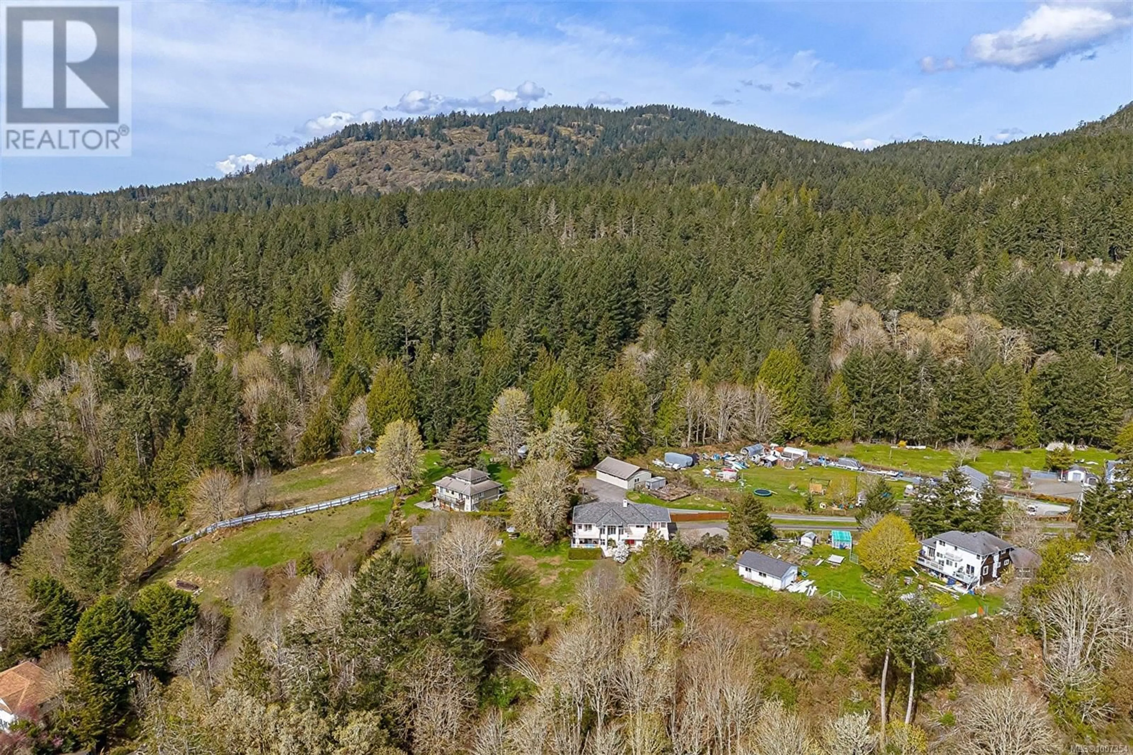 A pic from outside/outdoor area/front of a property/back of a property/a pic from drone, mountain view for 2212 AYUM ROAD, Sooke British Columbia V9Z0E7
