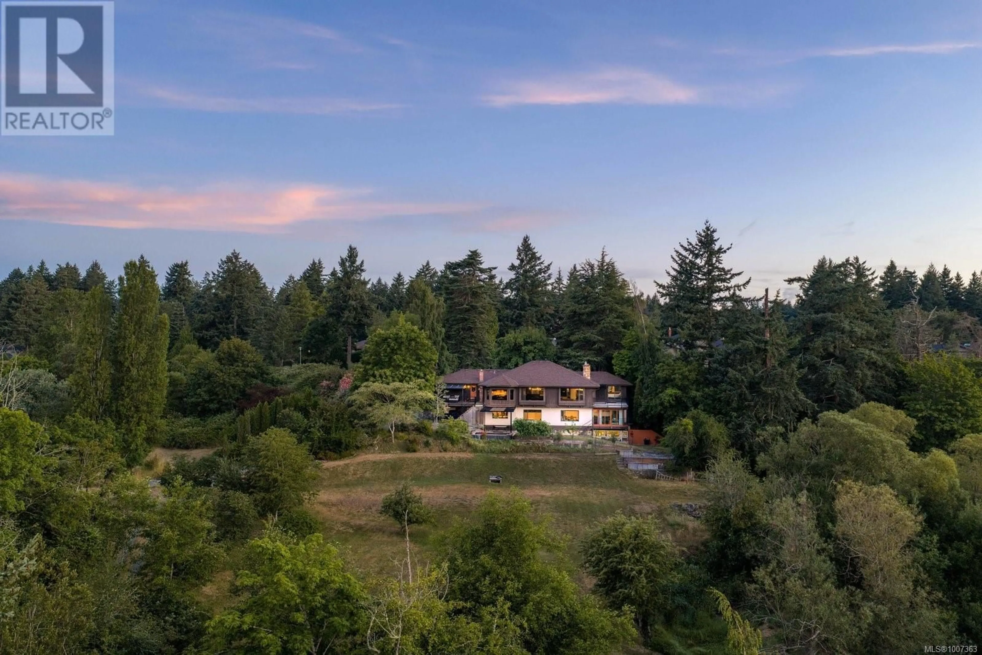 A pic from outside/outdoor area/front of a property/back of a property/a pic from drone, forest/trees view for 1070 DONWOOD DRIVE, Saanich British Columbia V8X4G3