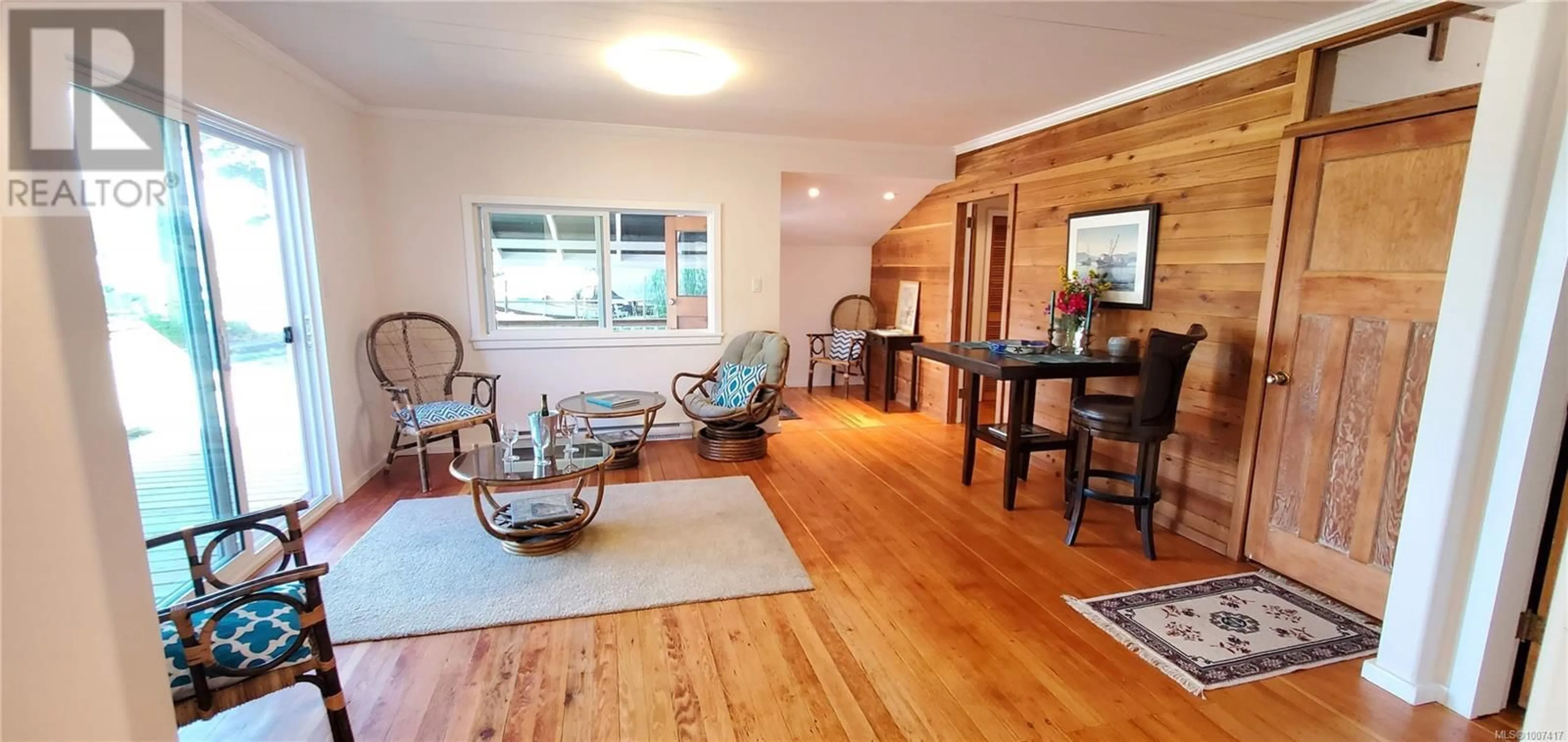 Living room with furniture, wood/laminate floor for 683 GREEN ROAD, Quadra Island British Columbia V0P1N0