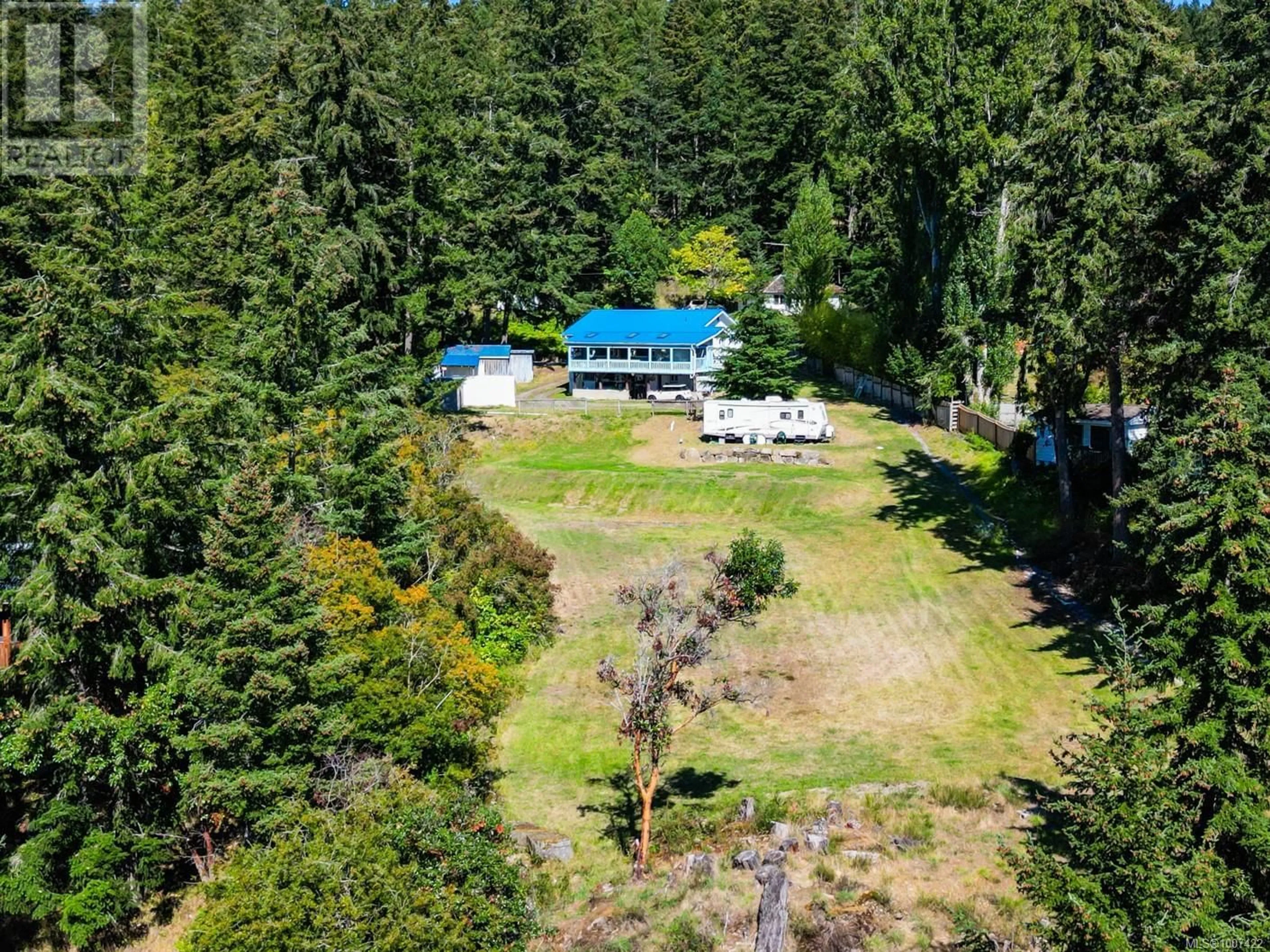 A pic from outside/outdoor area/front of a property/back of a property/a pic from drone, forest/trees view for 1325 MACKINNON ROAD, Pender Island British Columbia V0N2M1
