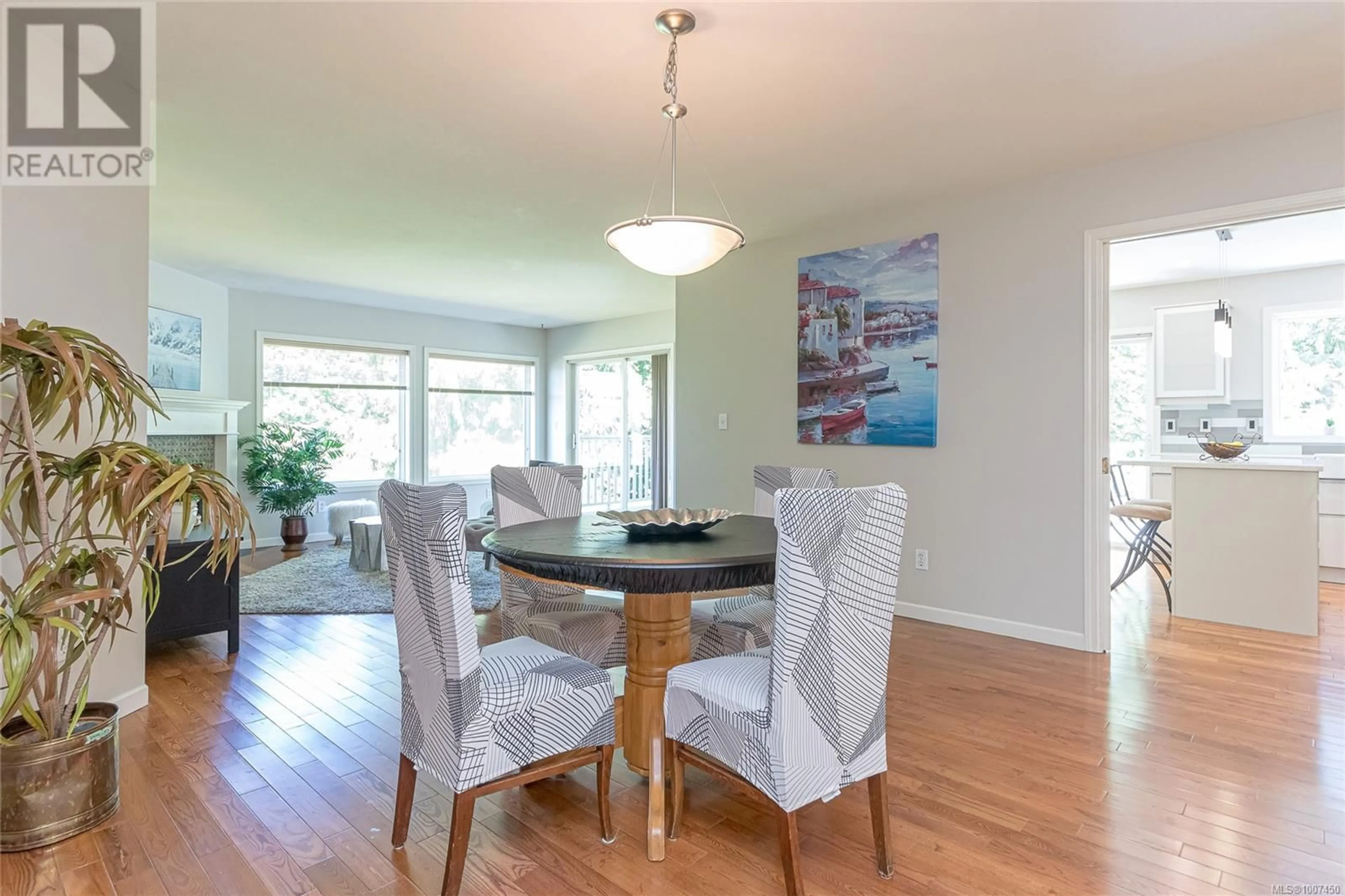 Dining room, wood/laminate floor for 677 WINDWARD WAY, Qualicum Beach British Columbia V9K2K4