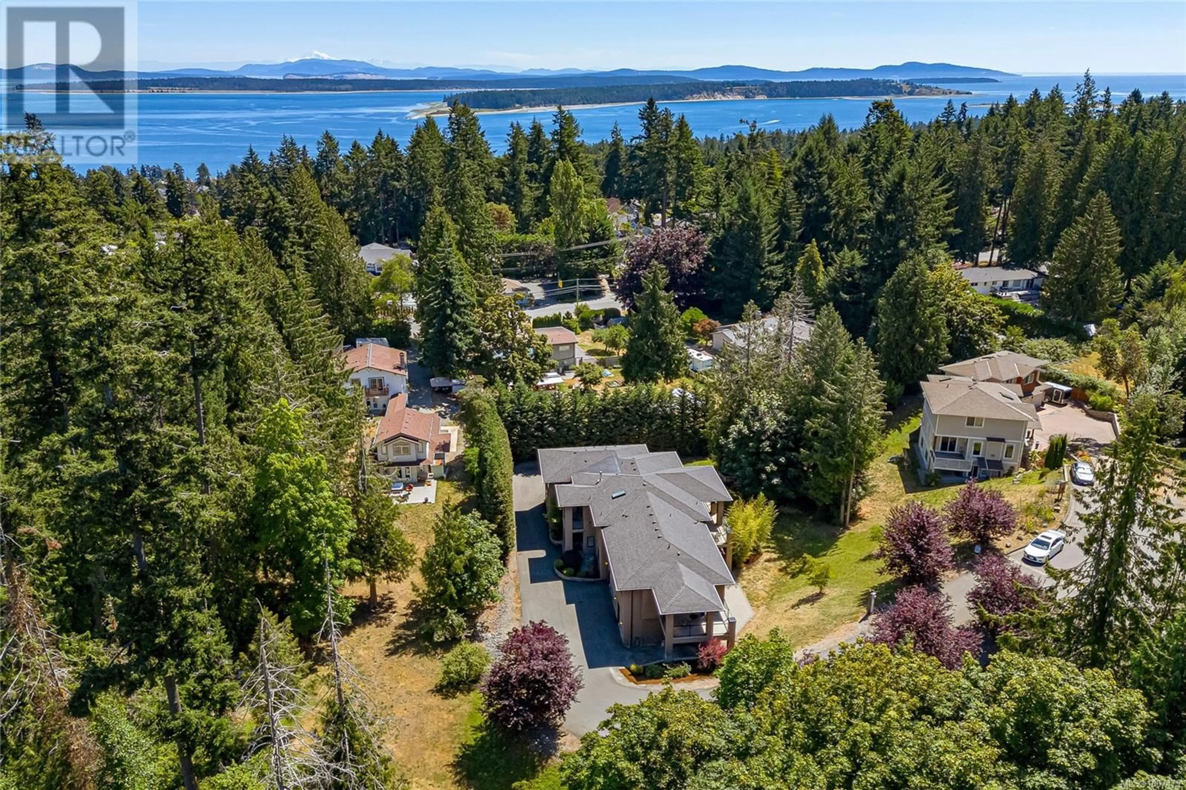 A pic from outside/outdoor area/front of a property/back of a property/a pic from drone, water/lake/river/ocean view for 1954 BARRETT DRIVE, North Saanich British Columbia V8L1A3