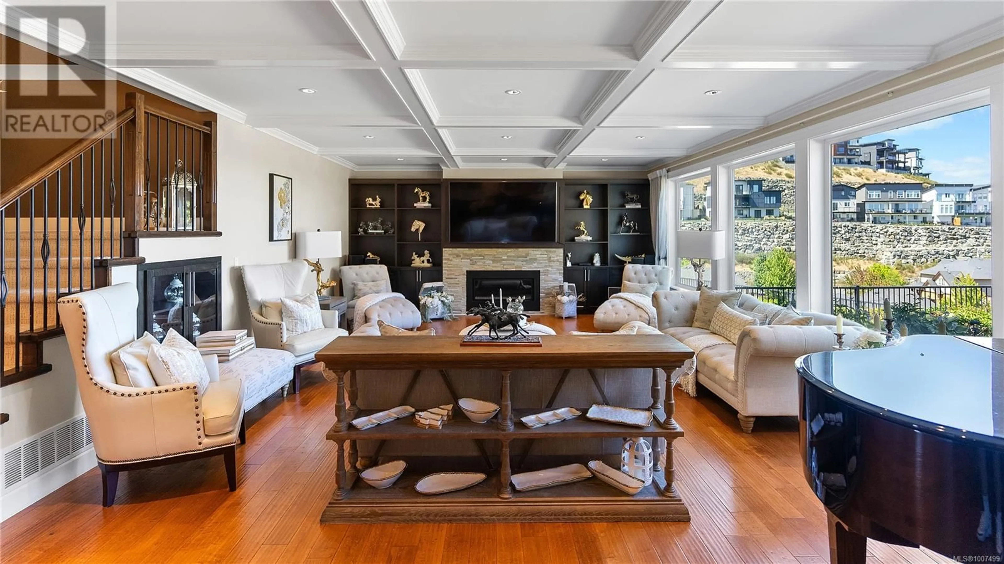 Living room with furniture, wood/laminate floor for 2328 NICKLAUS DRIVE, Langford British Columbia V9B0L2