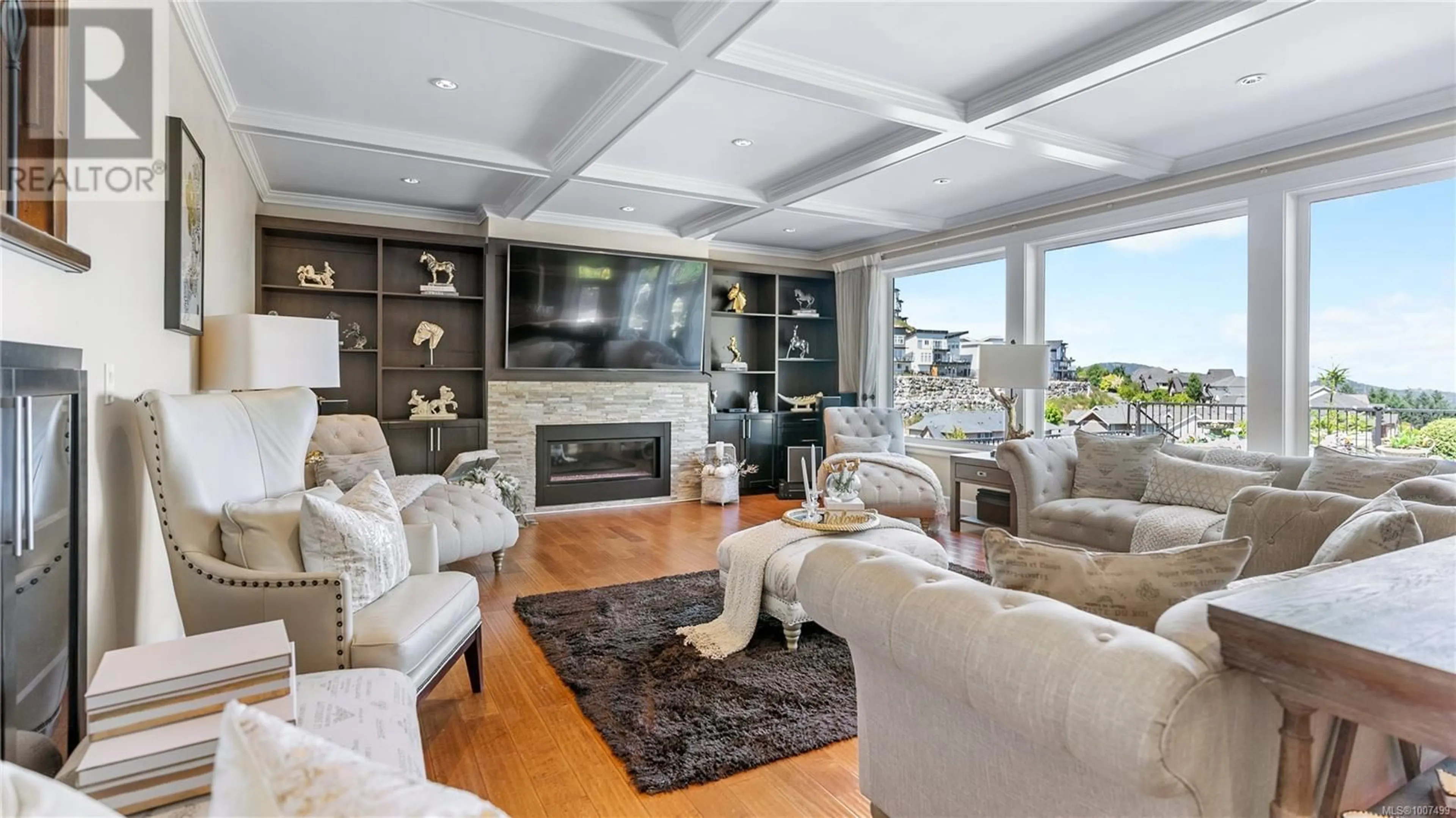 Living room with furniture, wood/laminate floor for 2328 NICKLAUS DRIVE, Langford British Columbia V9B0L2