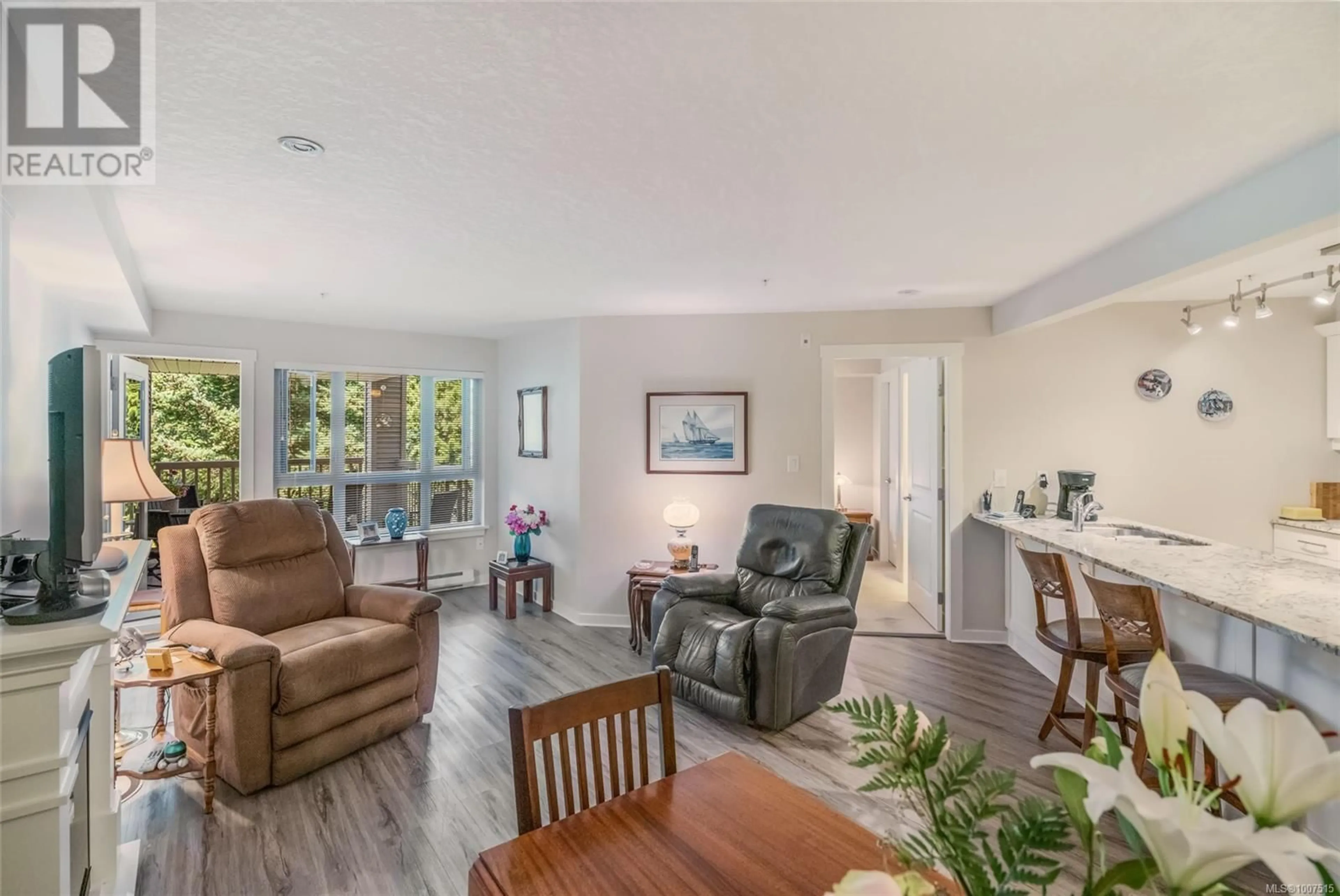 Living room with furniture, wood/laminate floor for 317 - 5670 EDGEWATER LANE, Nanaimo British Columbia V9T6K1