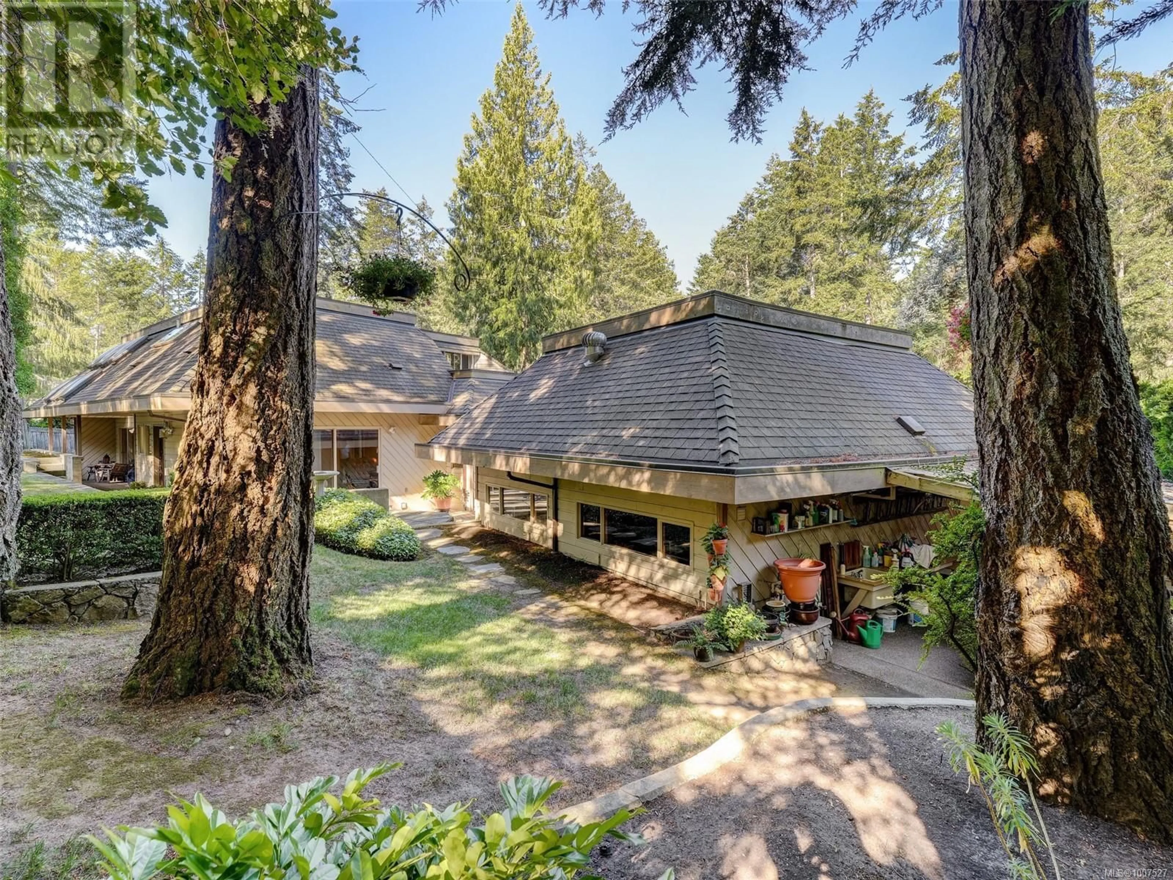 A pic from outside/outdoor area/front of a property/back of a property/a pic from drone, forest/trees view for 4469 EMILY CARR DRIVE, Saanich British Columbia V8X2N5