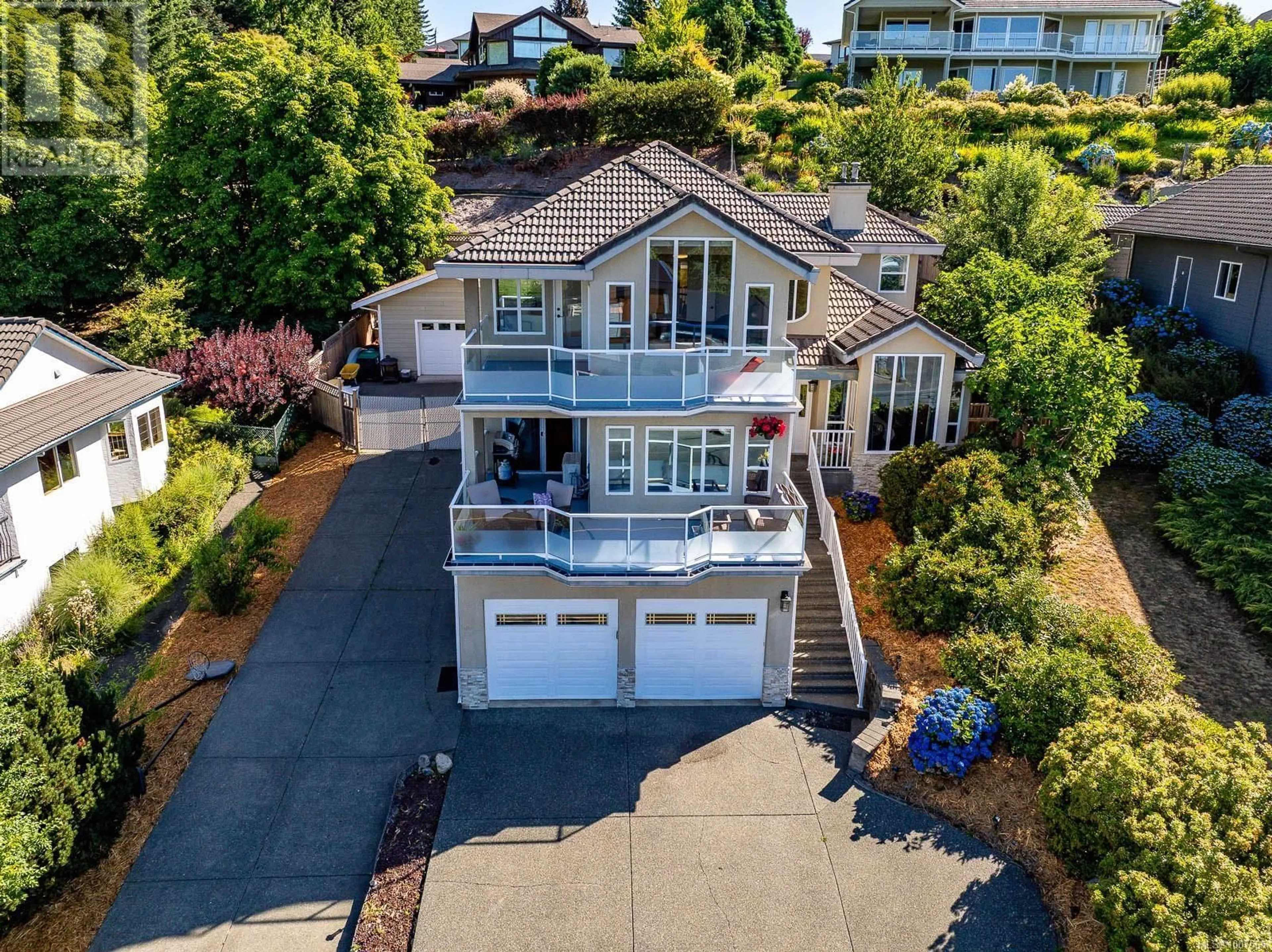 A pic from outside/outdoor area/front of a property/back of a property/a pic from drone, water/lake/river/ocean view for 1418 VALLEY VIEW DRIVE, Courtenay British Columbia V9N8T3