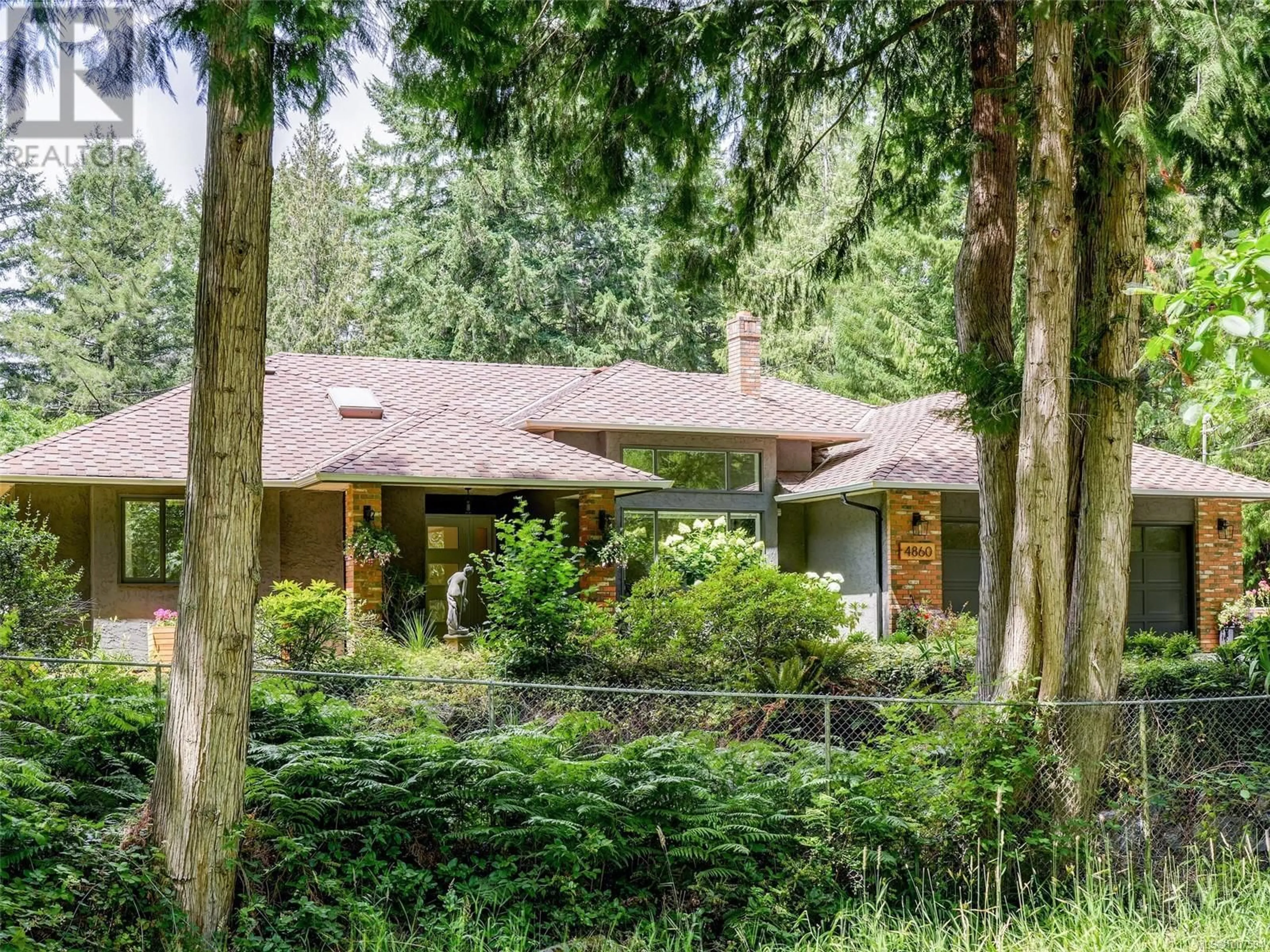 Home with brick exterior material, forest/trees view for 4860 EXCELSIOR ROAD, Saanich British Columbia V9E2E5