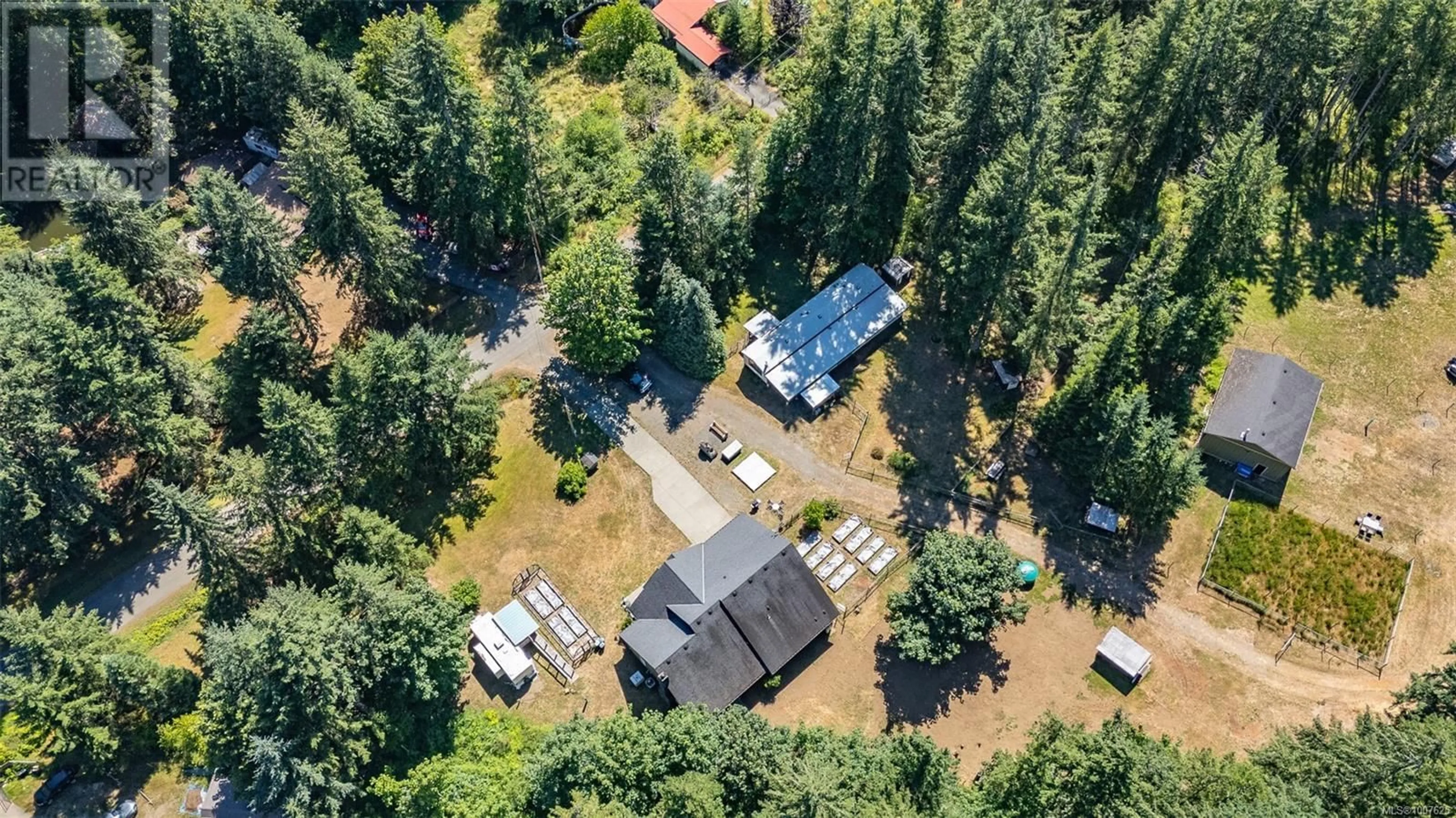 A pic from outside/outdoor area/front of a property/back of a property/a pic from drone, forest/trees view for 3476/3470 HEATHER ROAD, Black Creek British Columbia V9J1E5