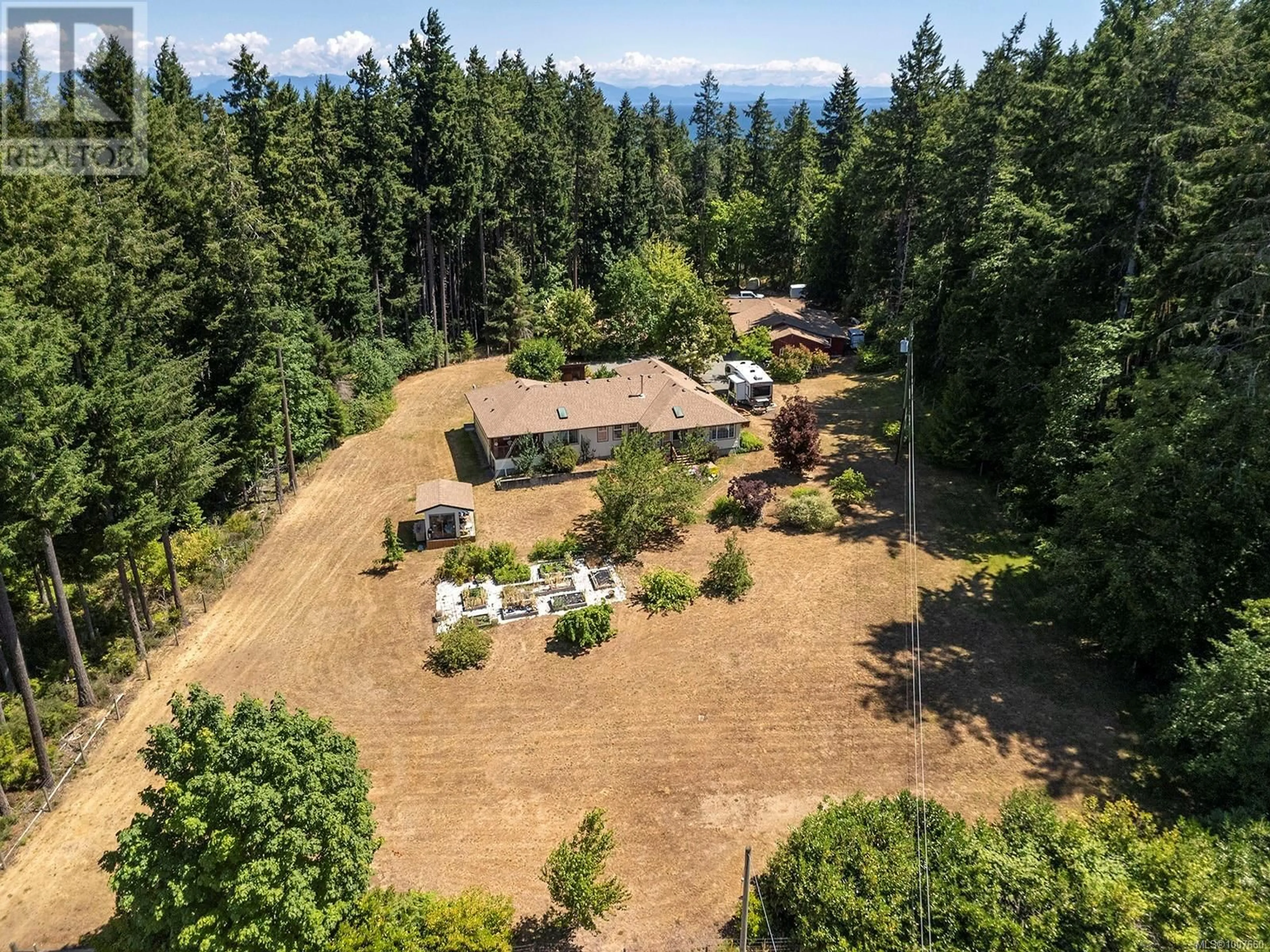 A pic from outside/outdoor area/front of a property/back of a property/a pic from drone, forest/trees view for 6411 BISHOP ROAD, Courtenay British Columbia V9J1V3