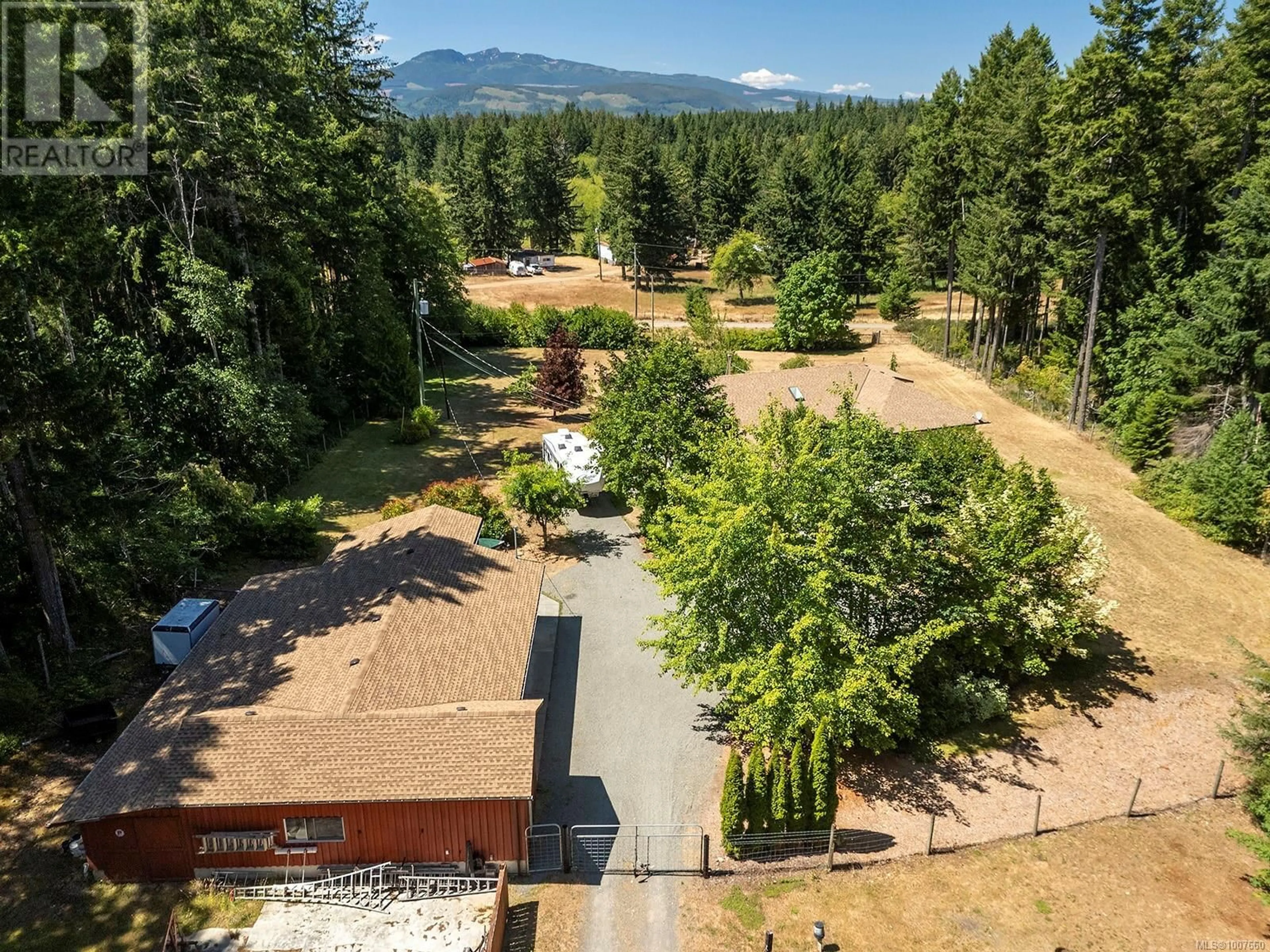 A pic from outside/outdoor area/front of a property/back of a property/a pic from drone, mountain view for 6411 BISHOP ROAD, Courtenay British Columbia V9J1V3