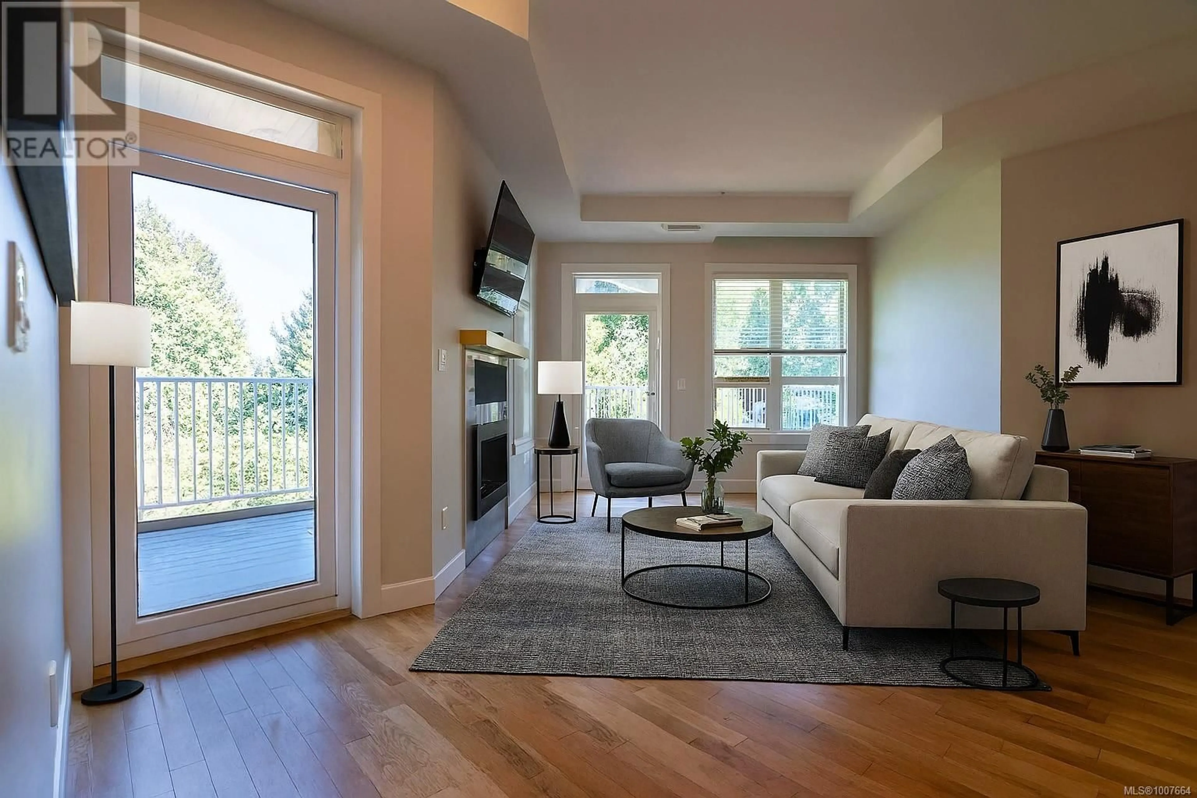 Living room with furniture, wood/laminate floor for 104 - 3111C HAVENWOOD LANE, Colwood British Columbia V9C0M7