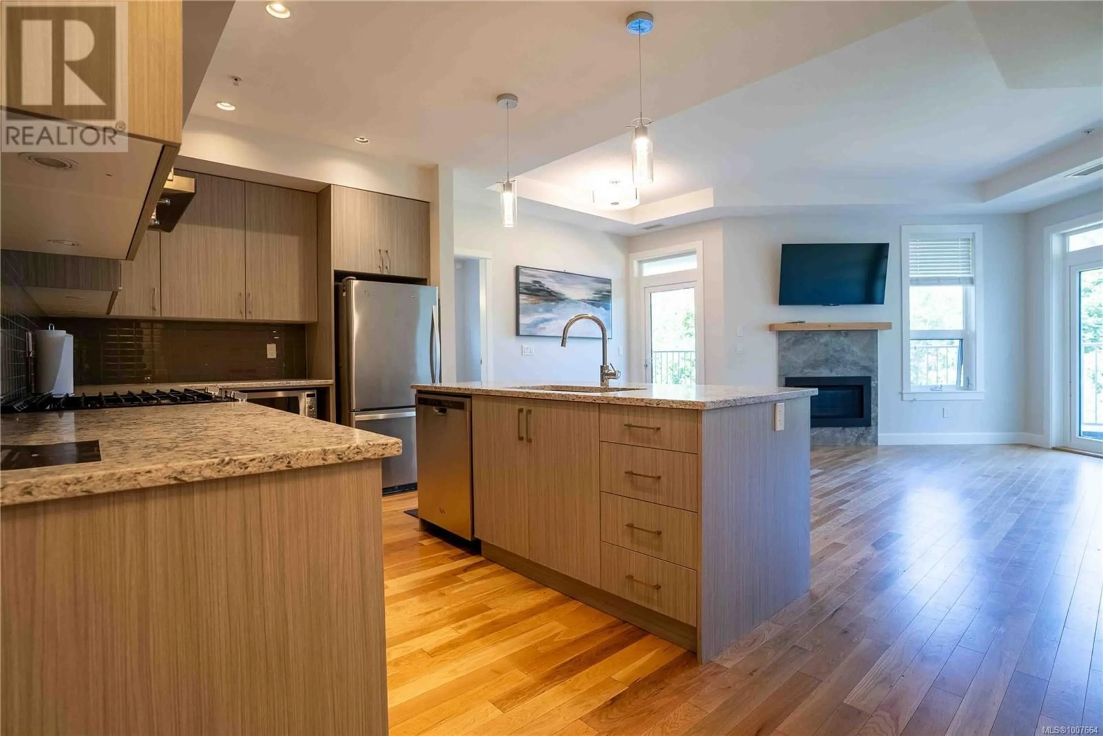Open concept kitchen, wood/laminate floor for 104 - 3111C HAVENWOOD LANE, Colwood British Columbia V9C0M7