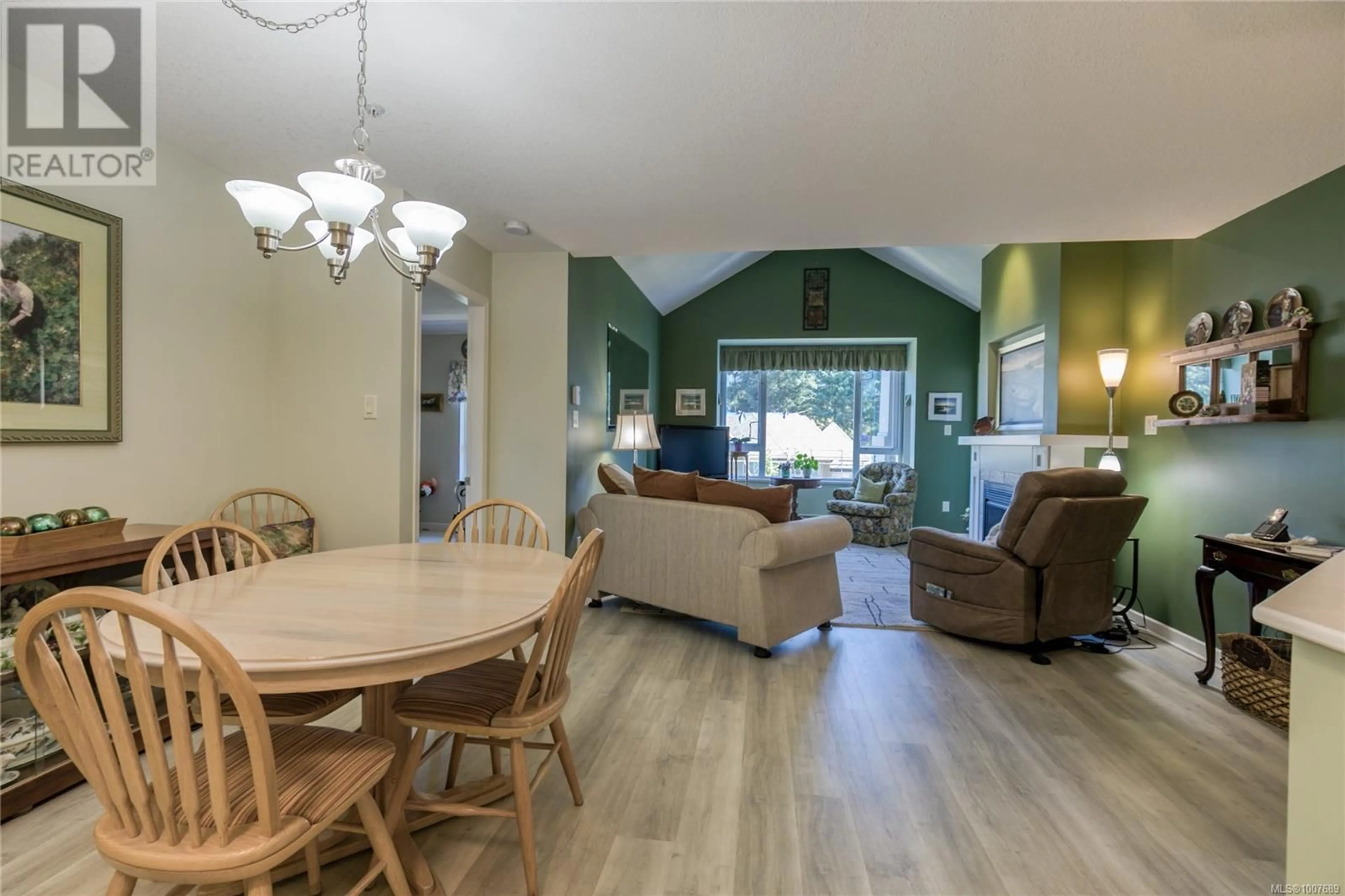 Living room with furniture, wood/laminate floor for 415 - 5685 EDGEWATER LANE, Nanaimo British Columbia V9T6K1