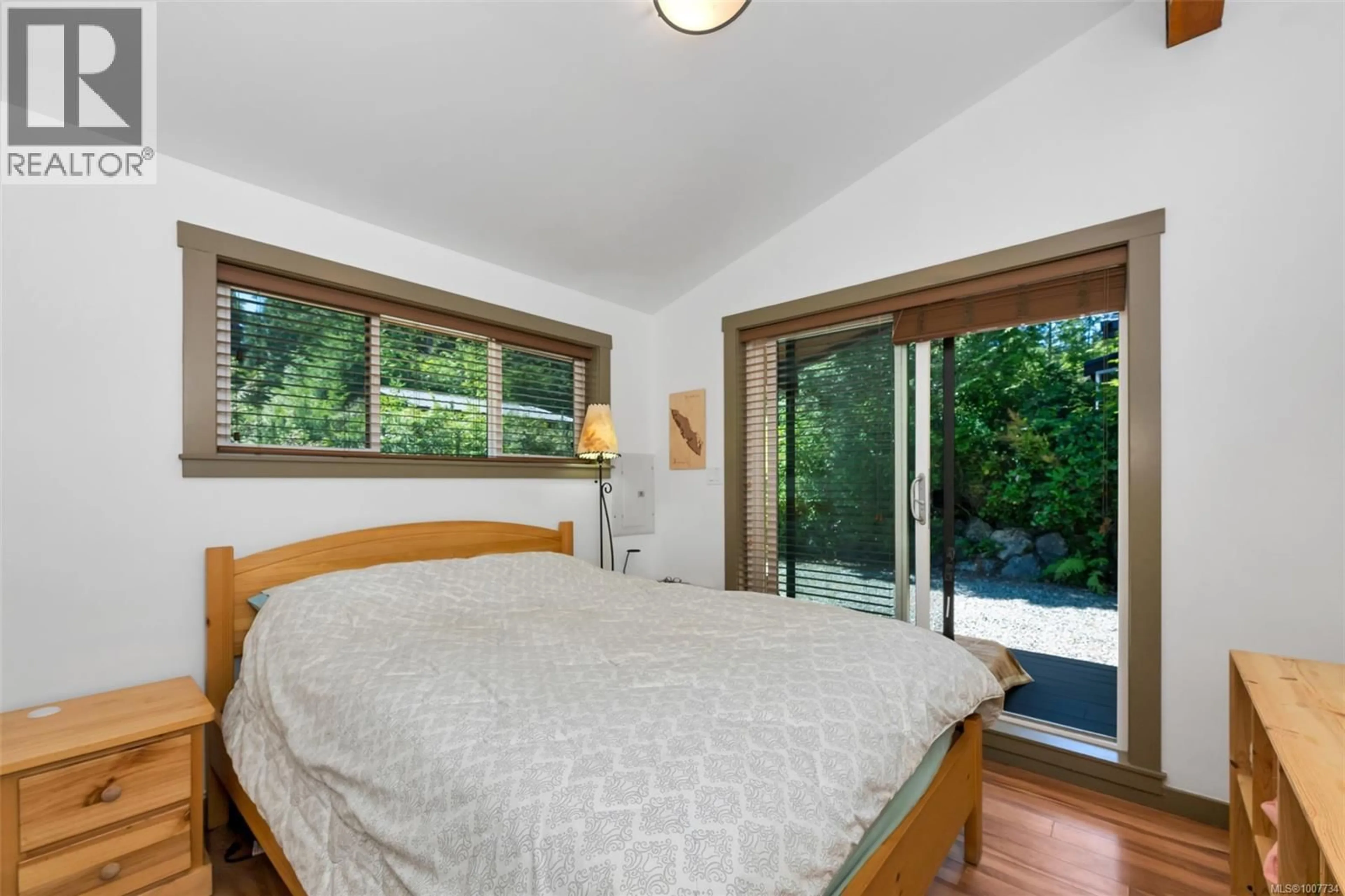 Bedroom with bed, wood/laminate floor for 40 - 6574 BAIRD ROAD, Port Renfrew British Columbia V0S1K0