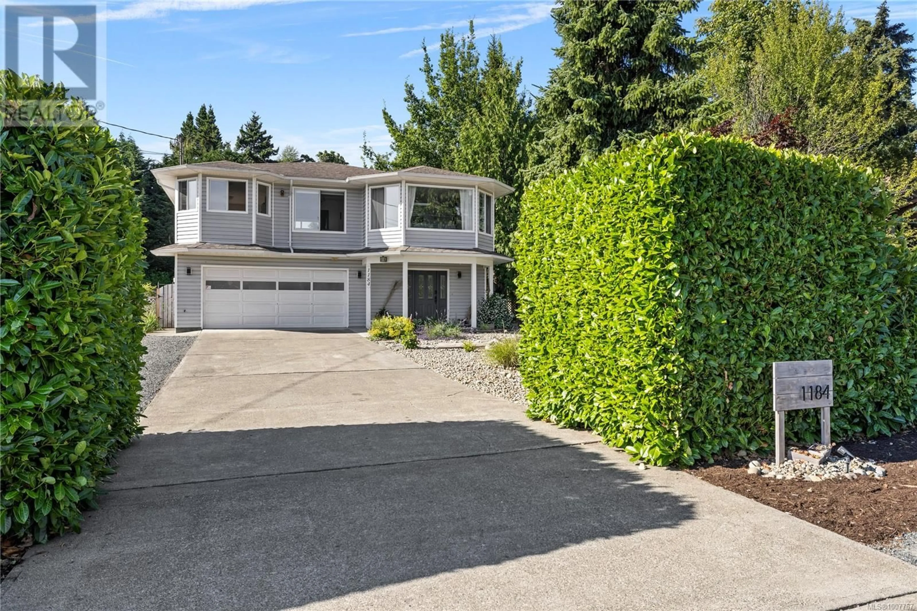 Home with vinyl exterior material, street for 1184 CENTRE ROAD, Qualicum Beach British Columbia V9K2G8