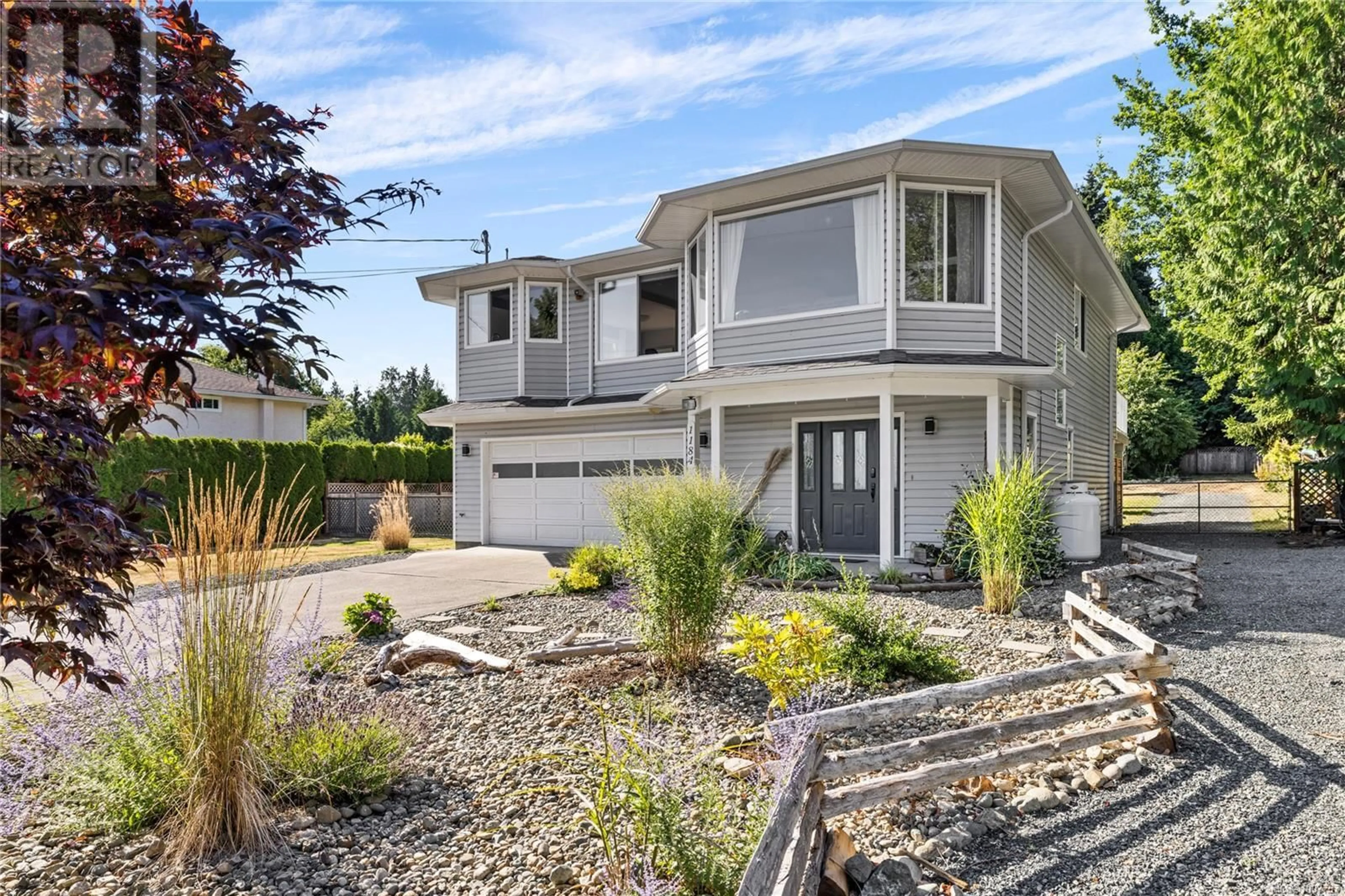 Home with vinyl exterior material, street for 1184 CENTRE ROAD, Qualicum Beach British Columbia V9K2G8
