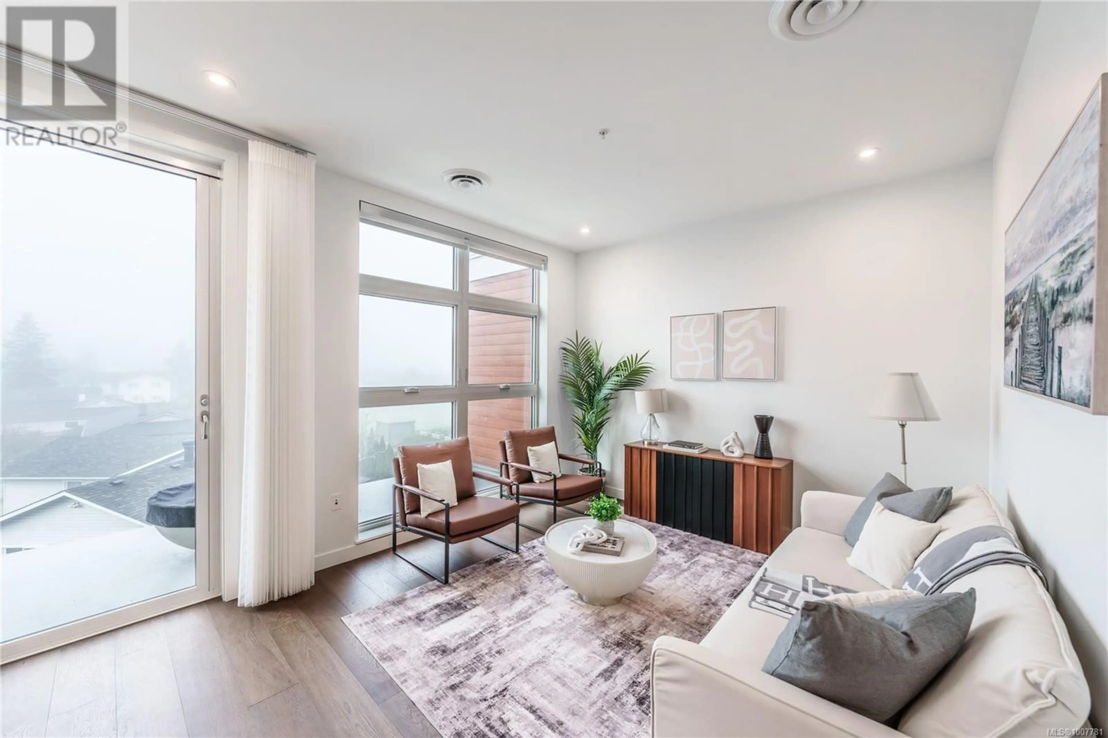 Living room with furniture, wood/laminate floor for 307 - 9570 FIFTH STREET, Sidney British Columbia V8L2W5