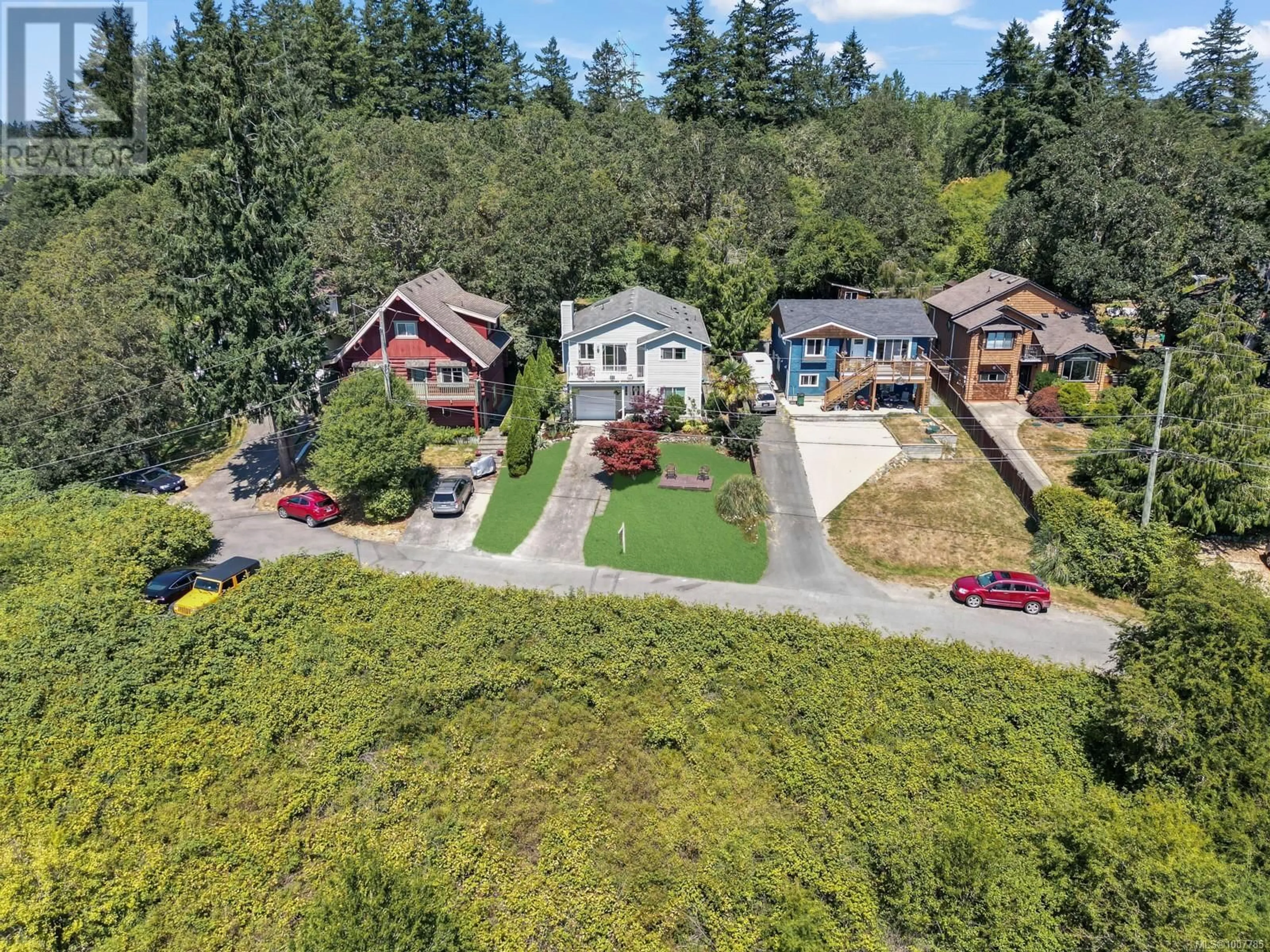 A pic from outside/outdoor area/front of a property/back of a property/a pic from drone, street for 1338 PRILLAMAN AVENUE, Saanich British Columbia V9E2C6