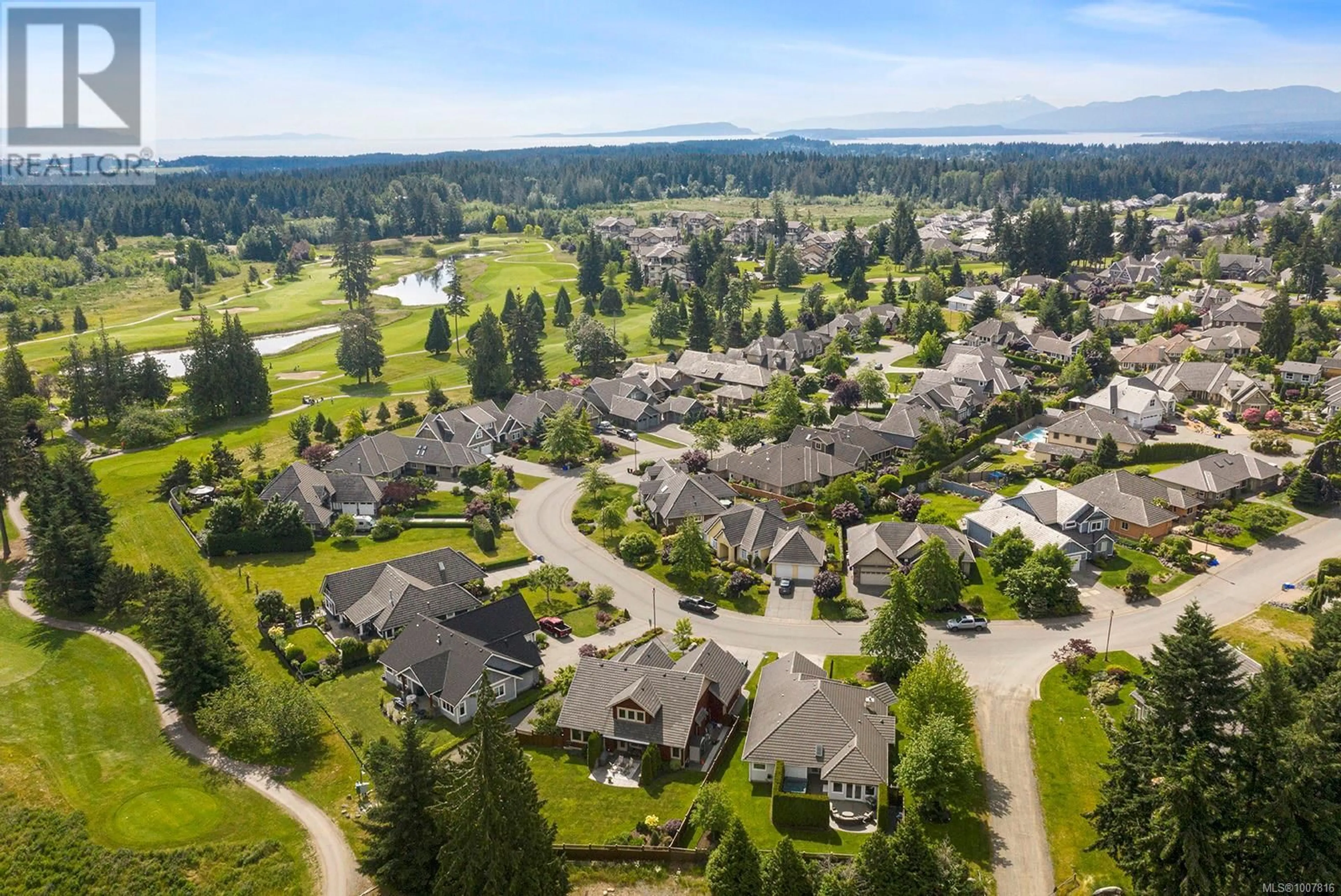 A pic from outside/outdoor area/front of a property/back of a property/a pic from drone, mountain view for 3300 MAJESTIC DRIVE, Courtenay British Columbia V9N9X5