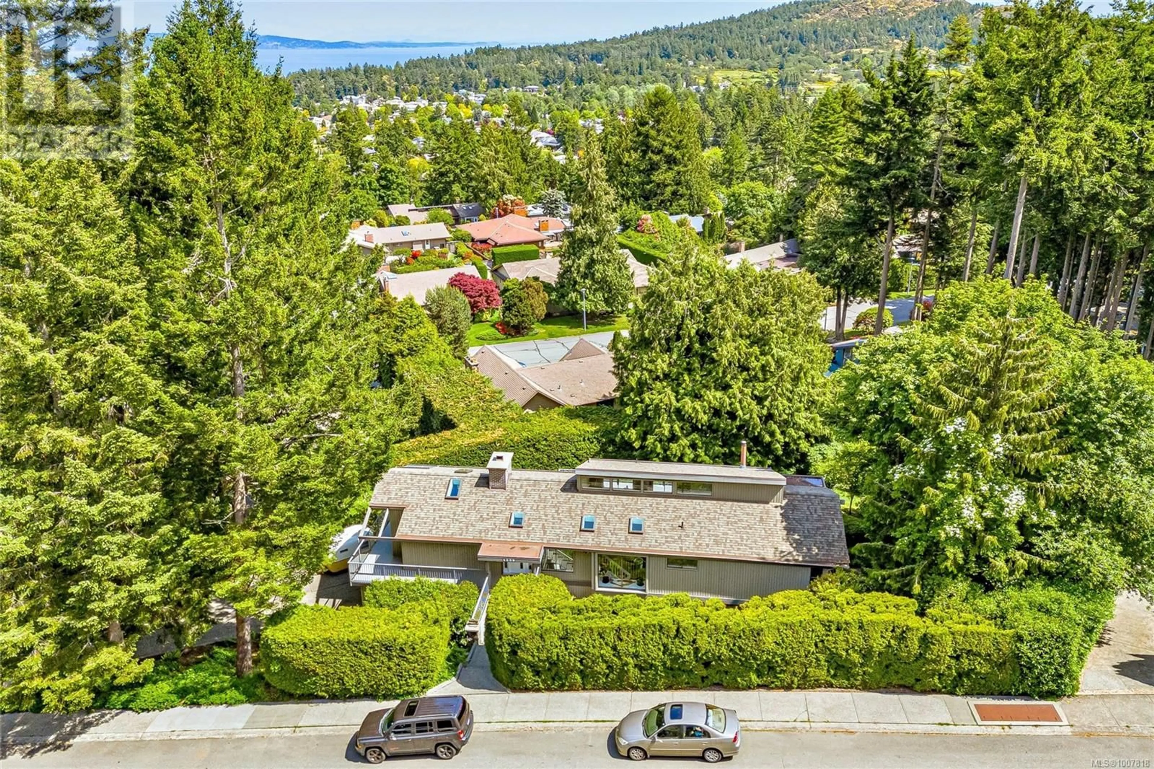 A pic from outside/outdoor area/front of a property/back of a property/a pic from drone, mountain view for 4689 BOULDERWOOD DRIVE, Saanich British Columbia V8Y2P8