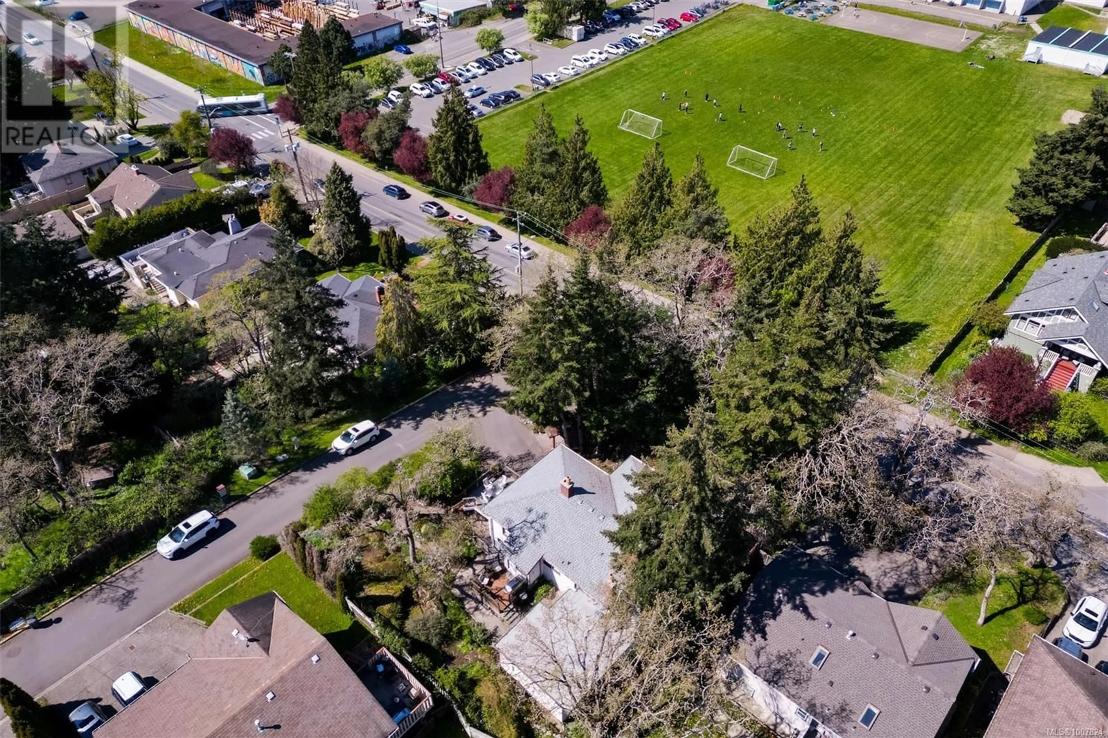 A pic from outside/outdoor area/front of a property/back of a property/a pic from drone, street for 1151 REYNOLDS ROAD, Saanich British Columbia V8P2K5