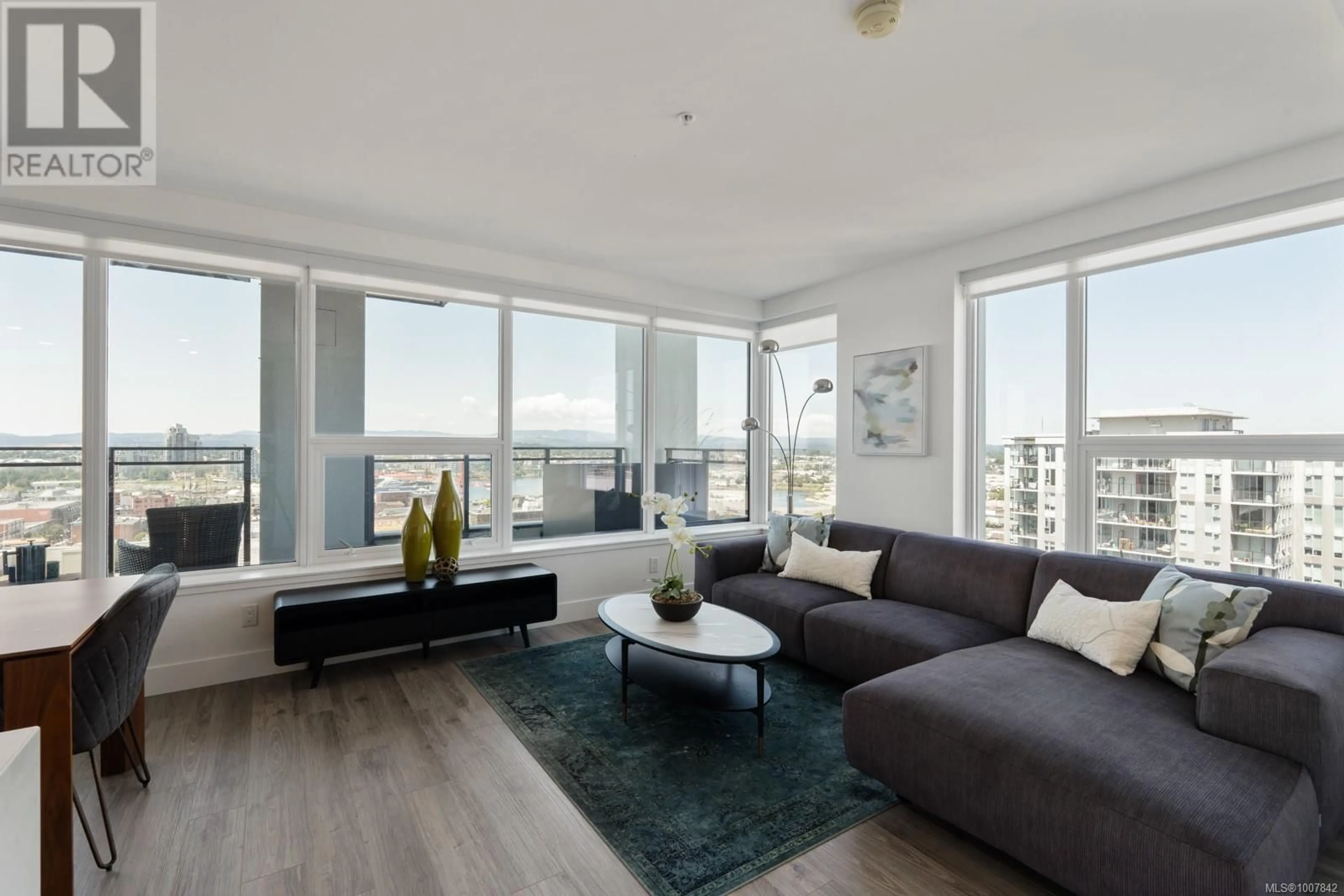 Living room with furniture, wood/laminate floor for 1403 - 777 HERALD STREET SOUTH, Victoria British Columbia V8T0C7