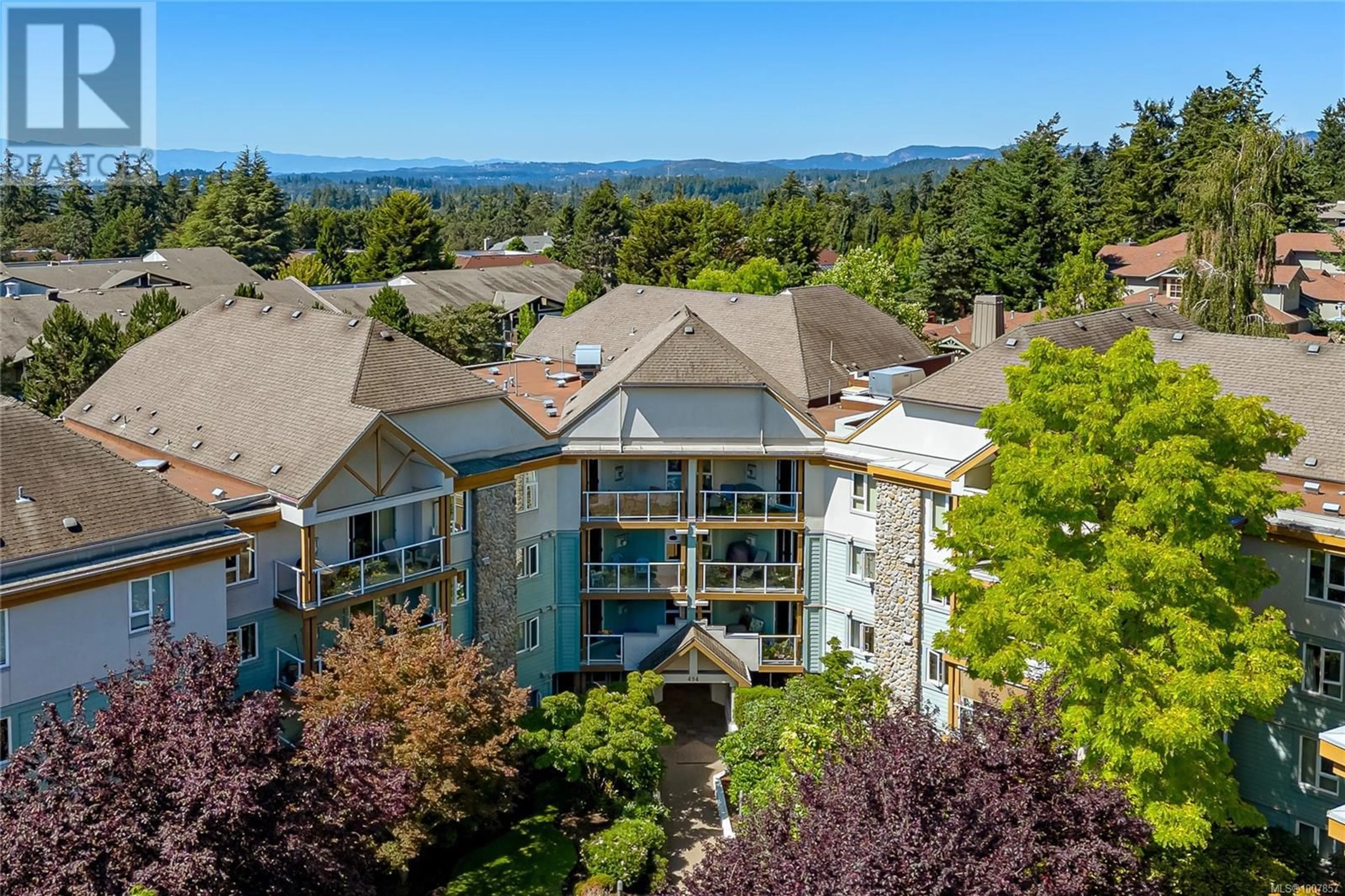 A pic from outside/outdoor area/front of a property/back of a property/a pic from drone, mountain view for 211 - 494 MARSETT PLACE, Saanich British Columbia V8Z7J1