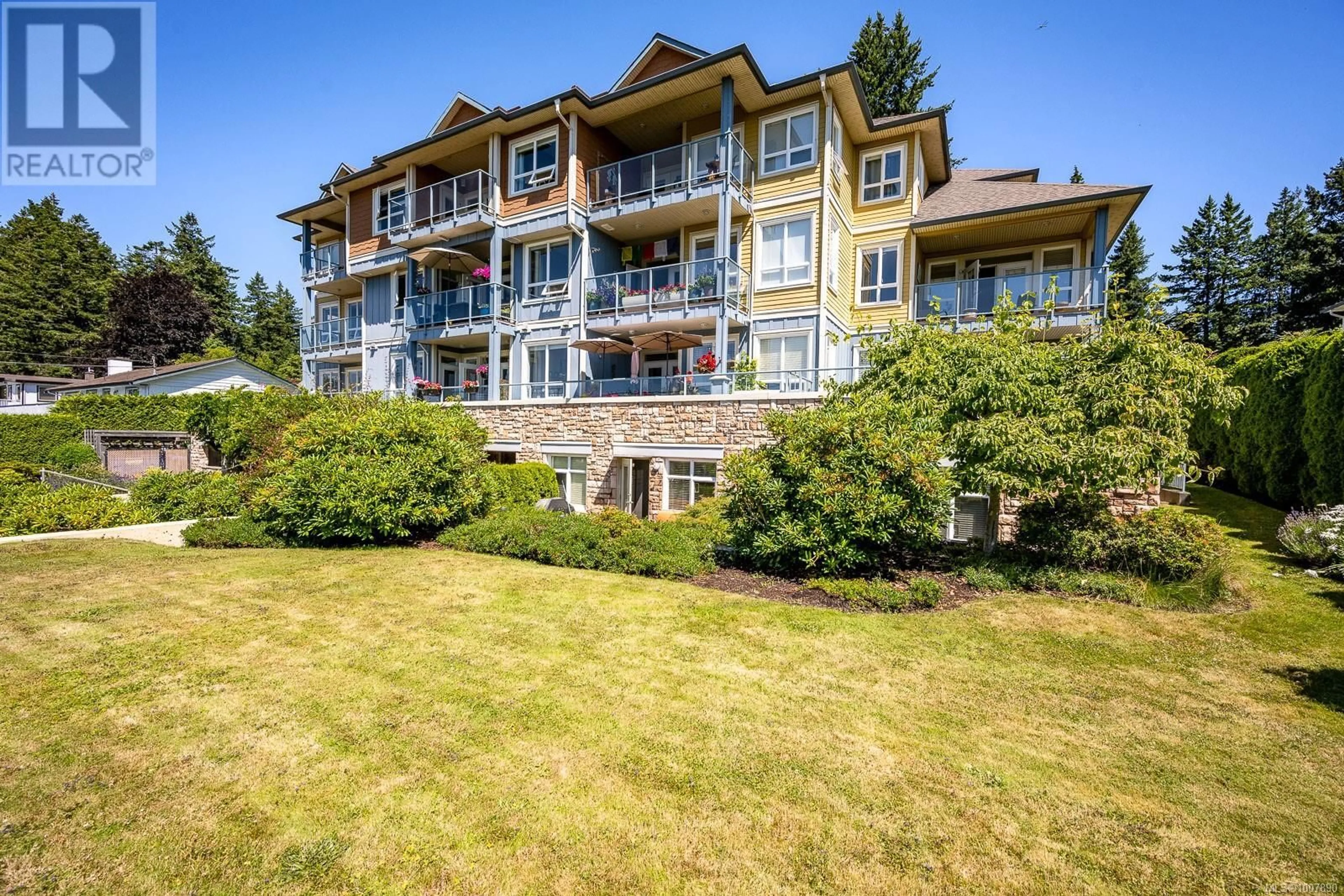 A pic from outside/outdoor area/front of a property/back of a property/a pic from drone, water/lake/river/ocean view for 302 - 1912 COMOX AVENUE, Comox British Columbia V9M3M7