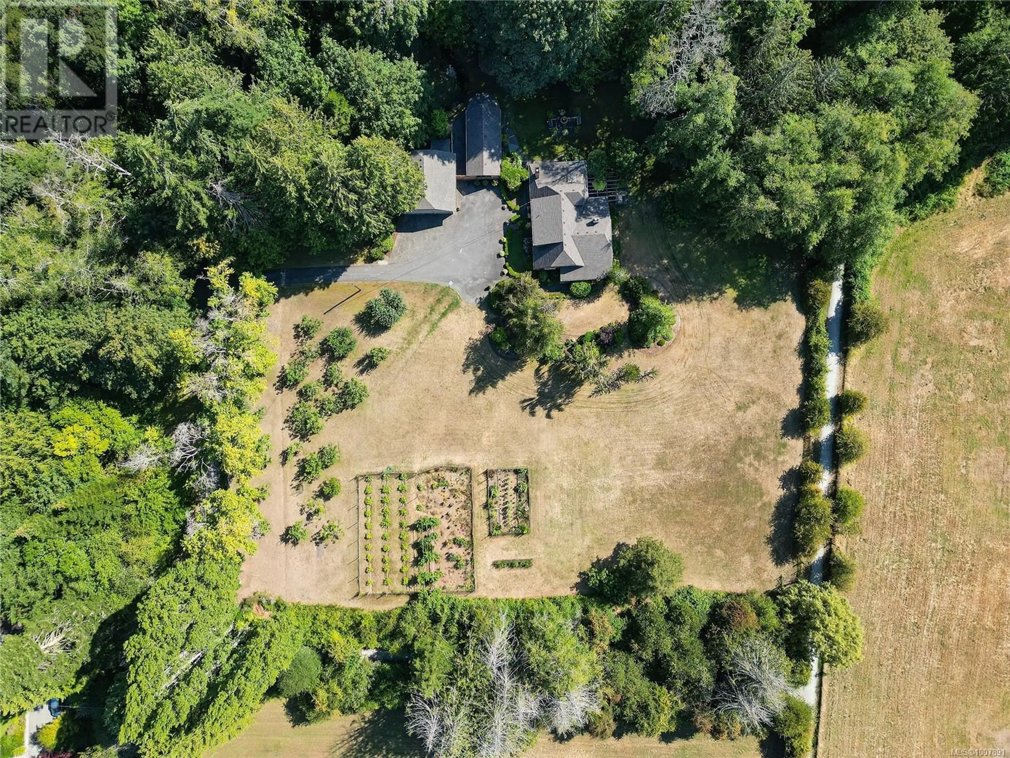 A pic from outside/outdoor area/front of a property/back of a property/a pic from drone, forest/trees view for 1695 CULTRA AVENUE, Central Saanich British Columbia V8M1T1