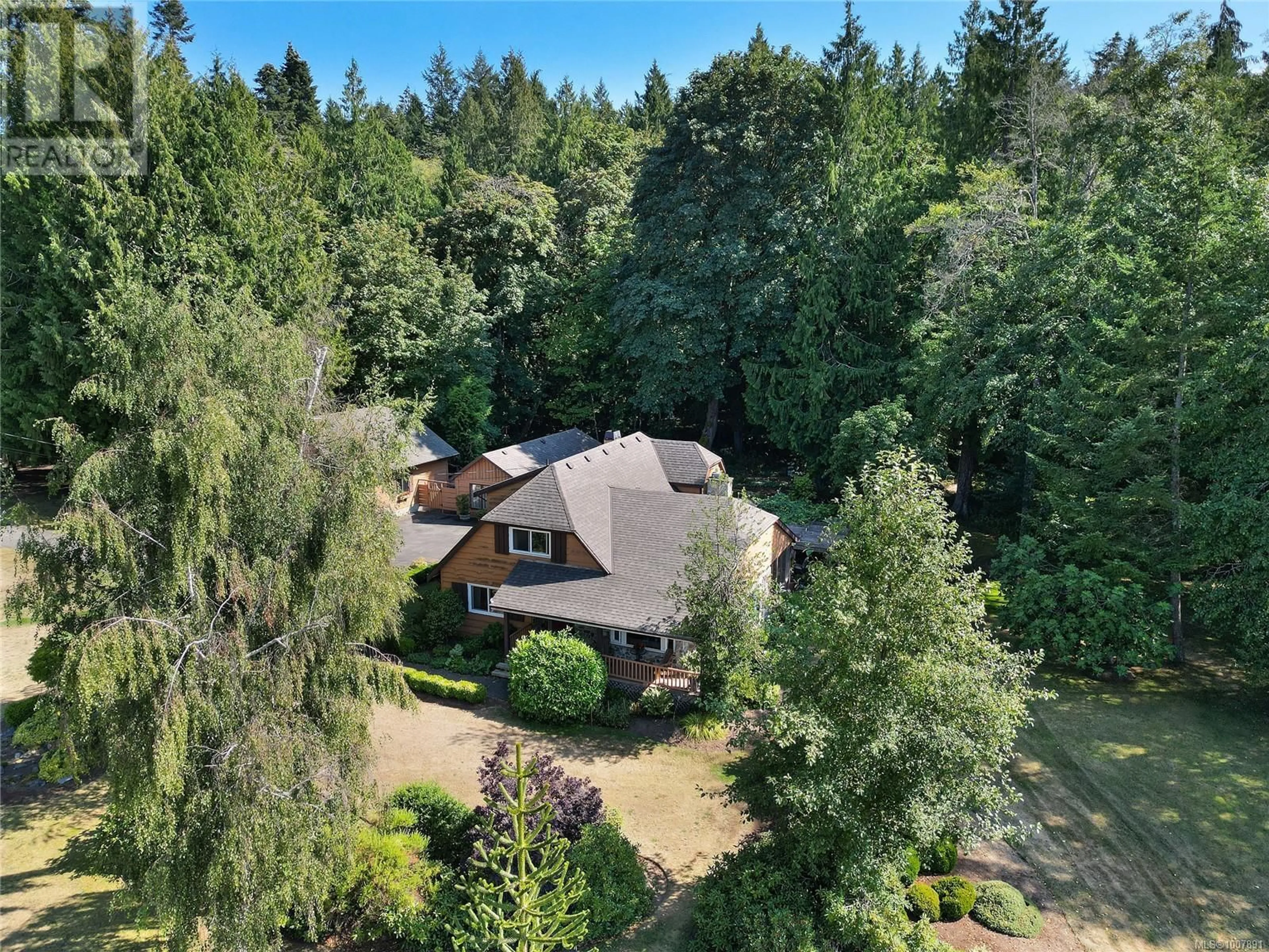 A pic from outside/outdoor area/front of a property/back of a property/a pic from drone, forest/trees view for 1695 CULTRA AVENUE, Central Saanich British Columbia V8M1T1