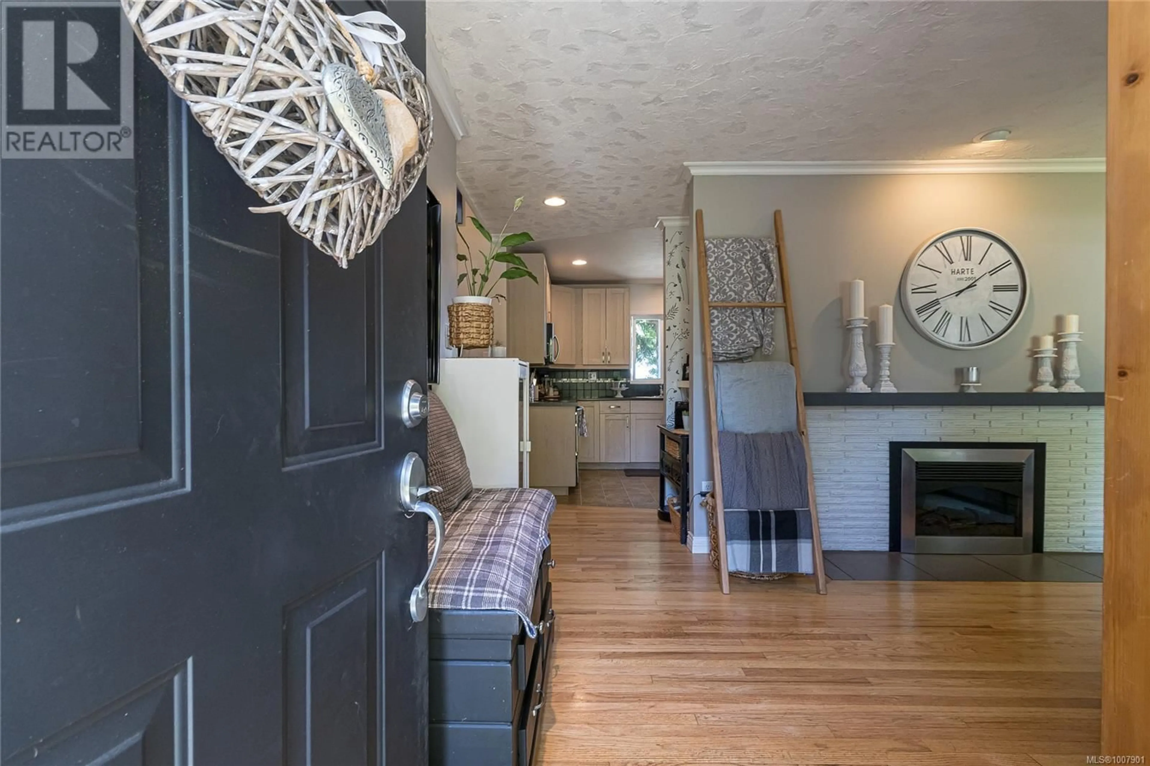 Open concept kitchen, wood/laminate floor for 4508 DUART ROAD, Saanich British Columbia V8N3K2