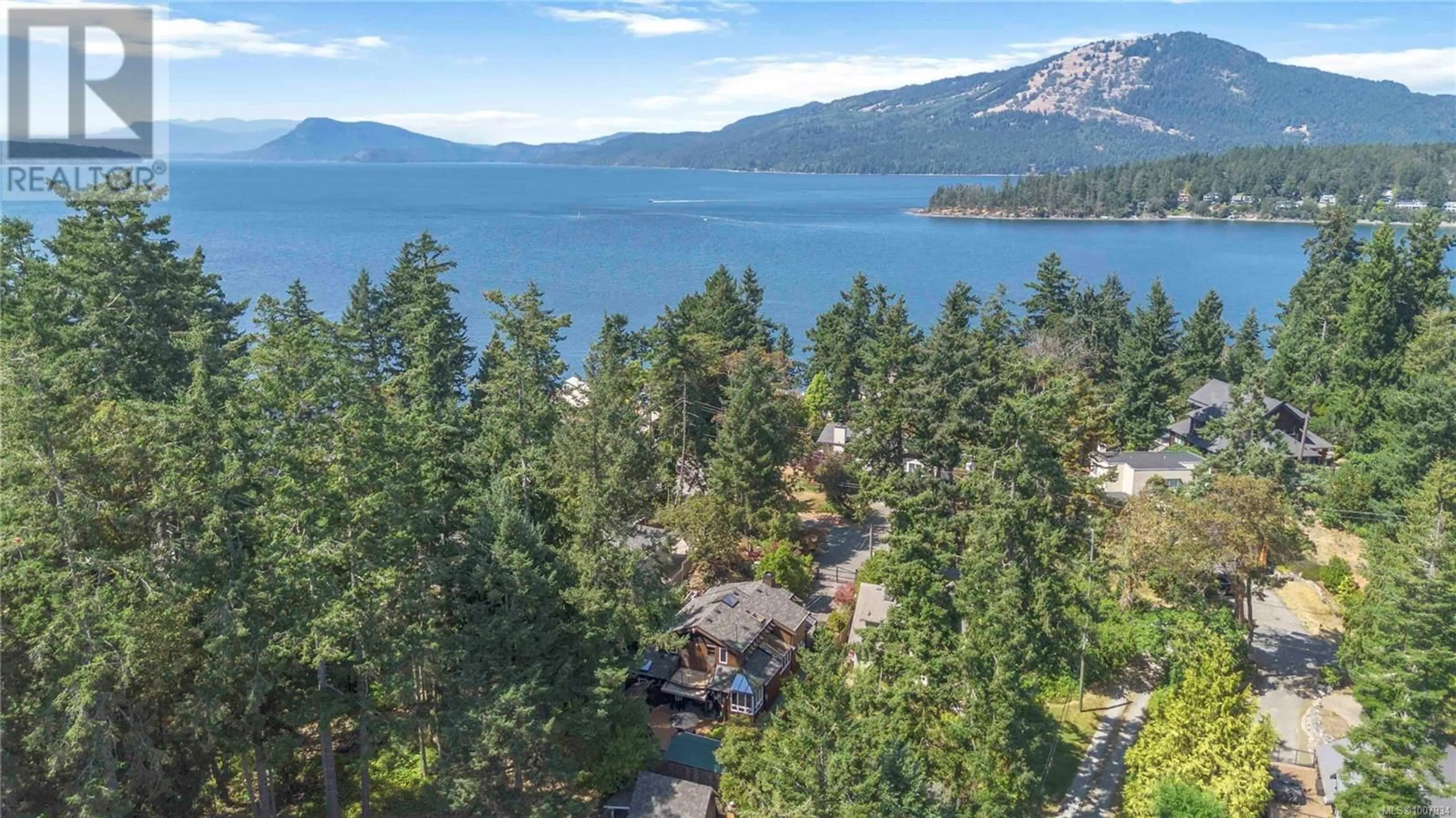 A pic from outside/outdoor area/front of a property/back of a property/a pic from drone, water/lake/river/ocean view for 10937 MADRONA DRIVE, North Saanich British Columbia V8L5P2