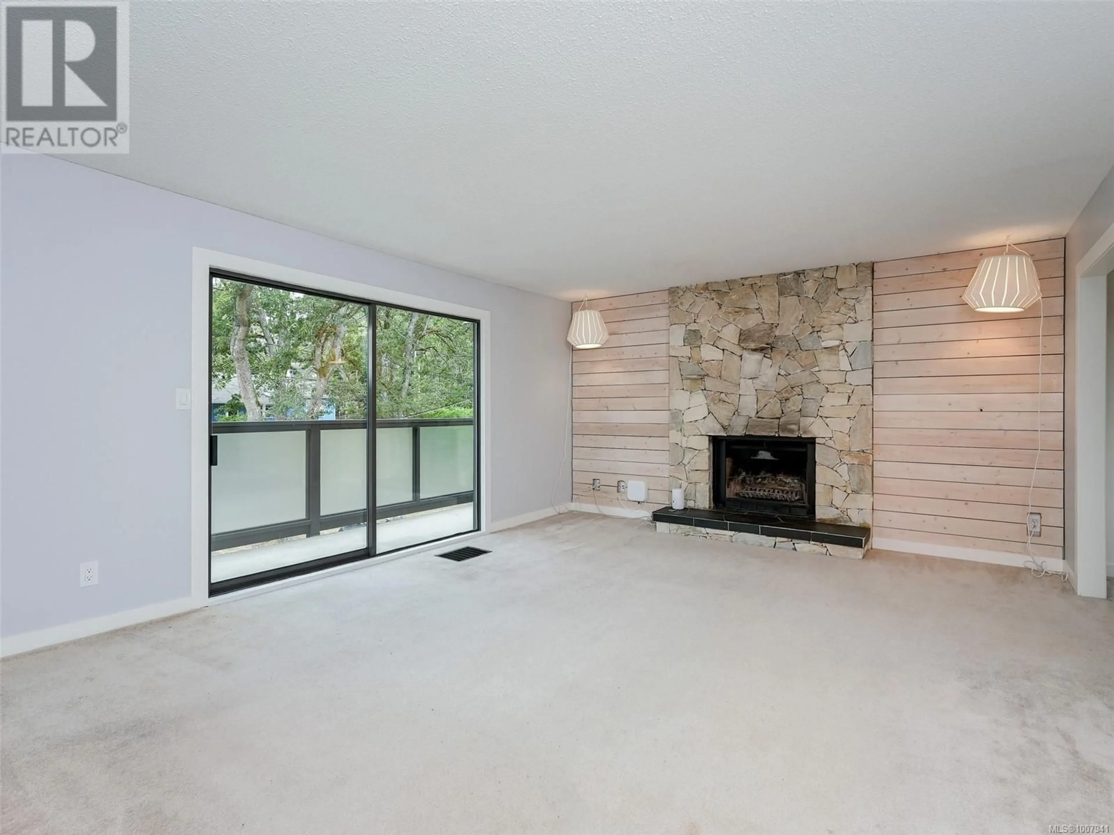 Living room with furniture, wood/laminate floor for 4125 CEDAR HILL ROAD, Saanich British Columbia V8N3C2