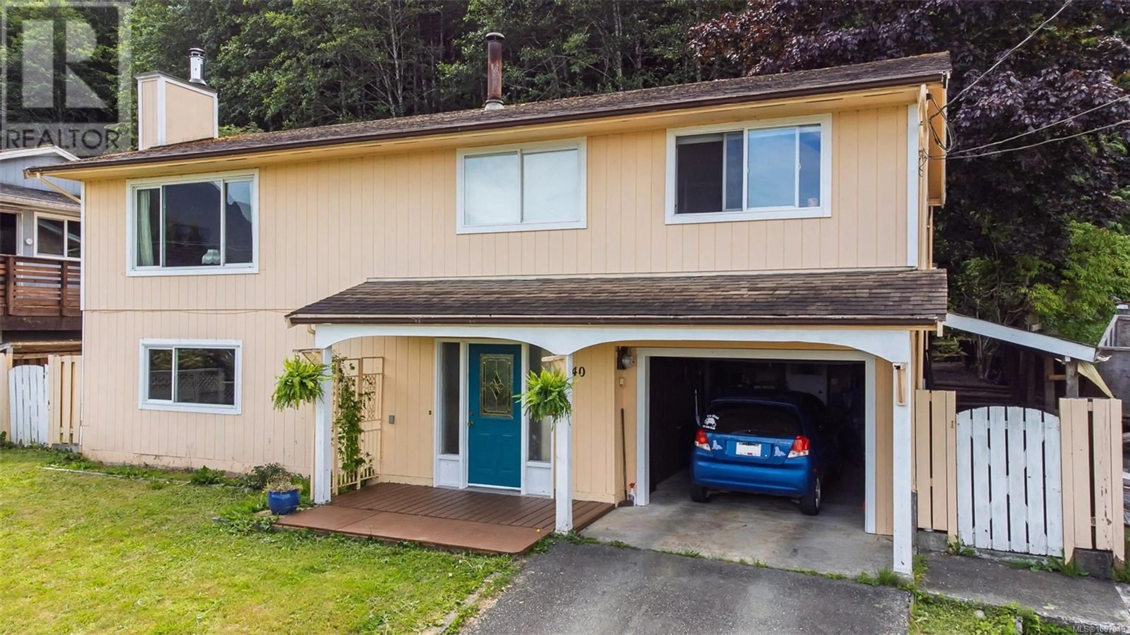 Home with vinyl exterior material, street for 540 MACMILLAN DRIVE, Sayward British Columbia V0P1R0