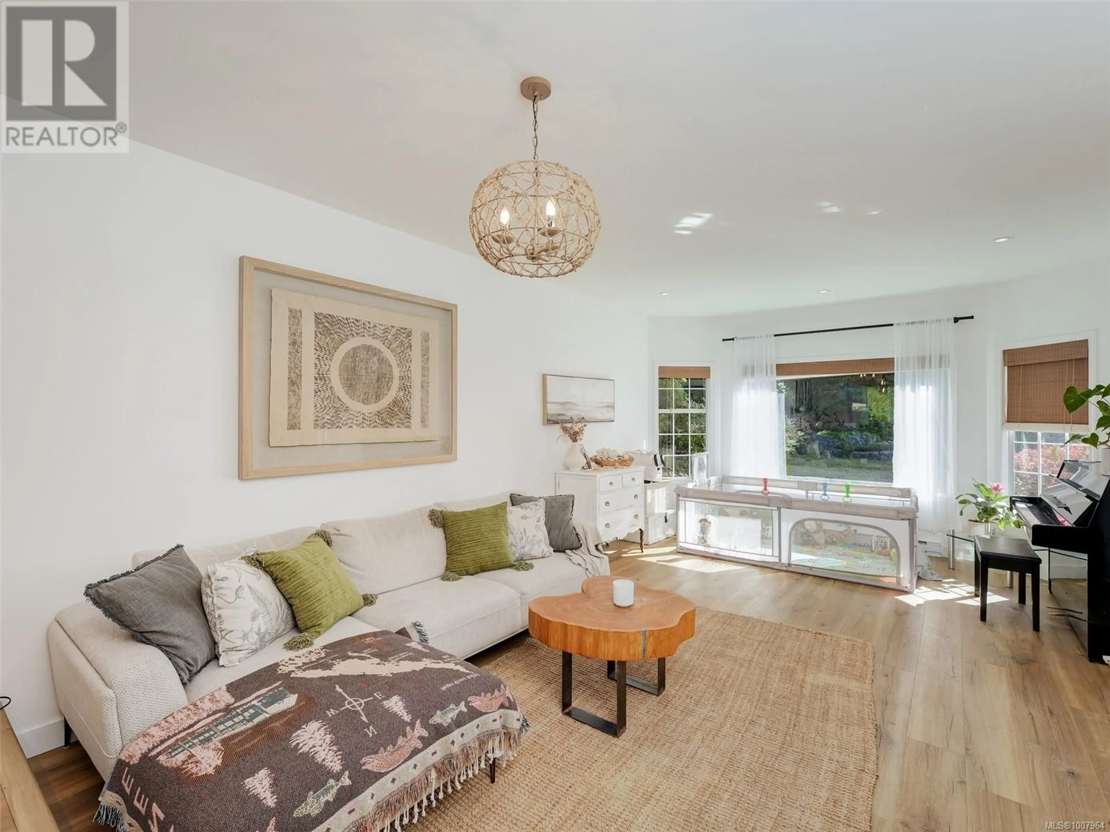 Living room with furniture, wood/laminate floor for 2146 HENLYN DRIVE, Sooke British Columbia V9Z0N5