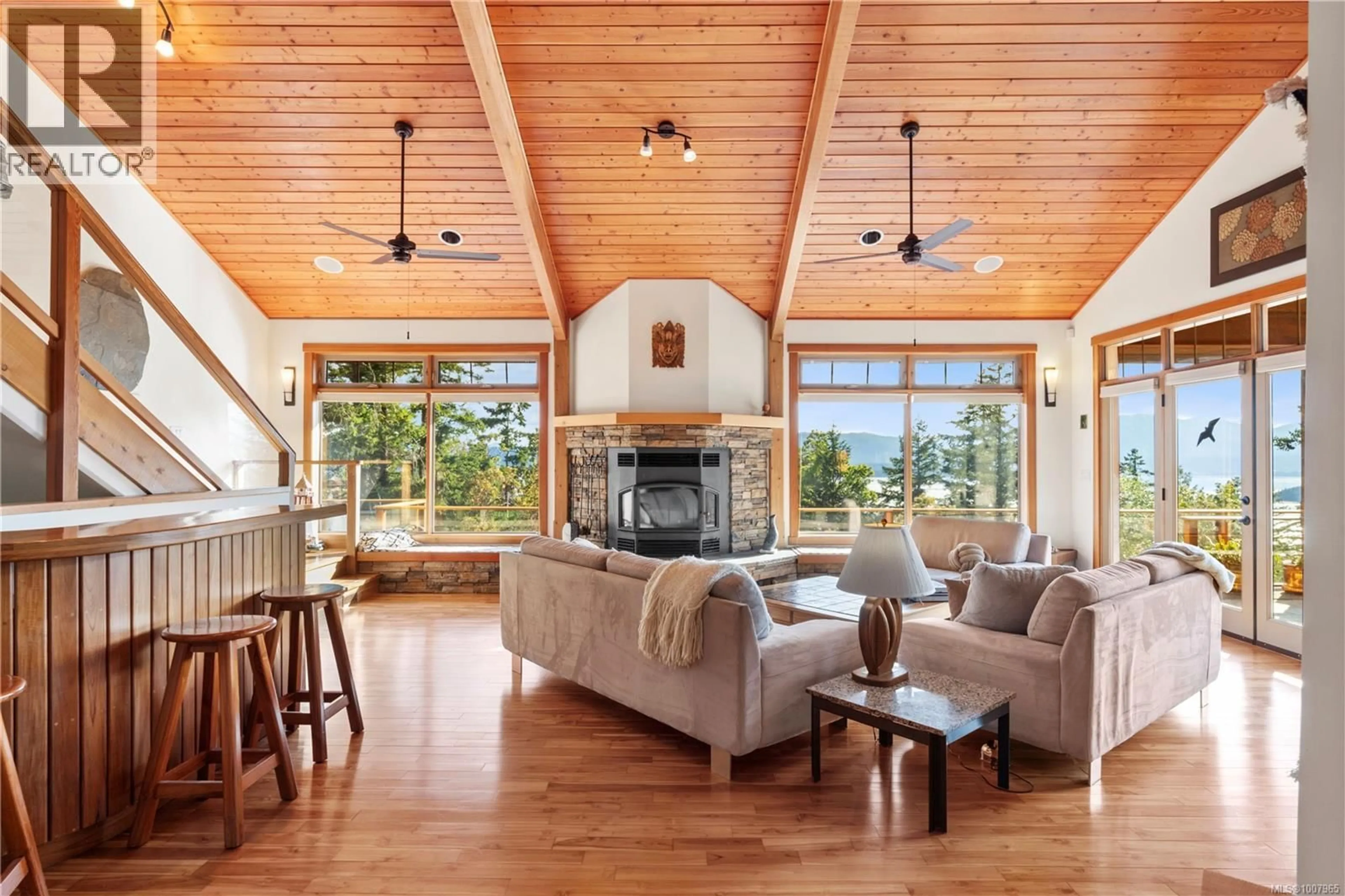 Living room with furniture, wood/laminate floor for 248 SUNEAGLE DRIVE, Salt Spring British Columbia V8K1E5