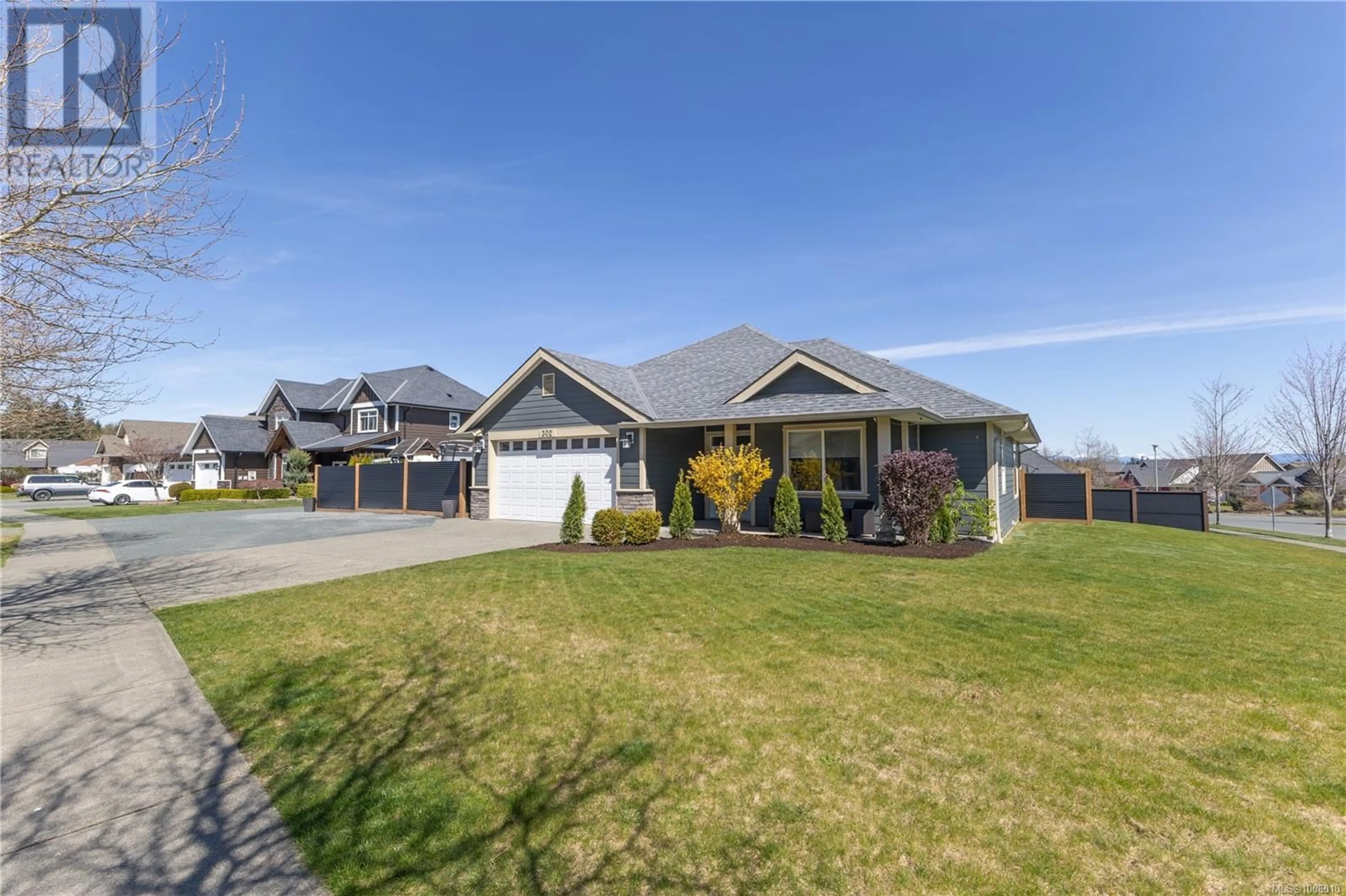 Home with vinyl exterior material, street for 302 MARYLAND ROAD, Campbell River British Columbia V9W0A5