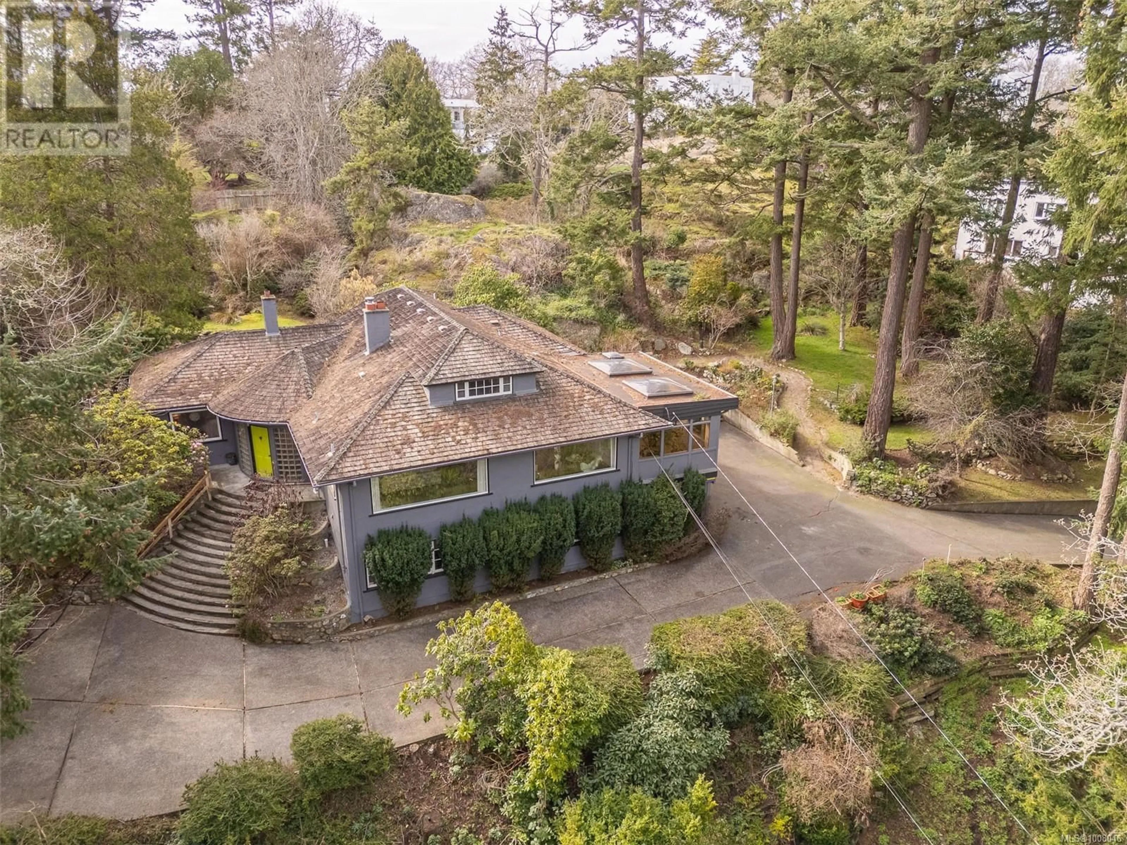 A pic from outside/outdoor area/front of a property/back of a property/a pic from drone, forest/trees view for 52 SYLVAN LANE, Oak Bay British Columbia V8S2K8